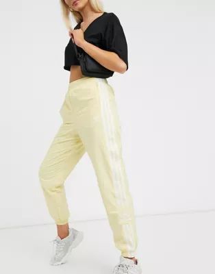 adidas Originals adicolor track pants in yellow | ASOS (Global)