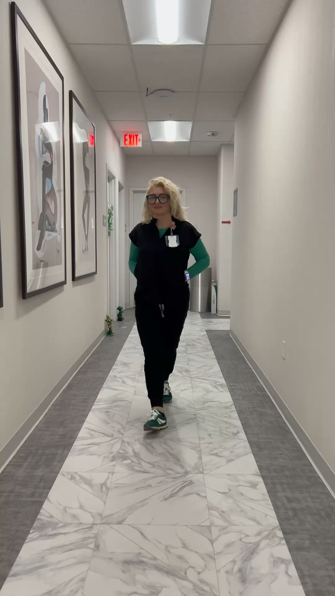 If you wear black scrubs every day, this is the one thing that makes them feel like an actual outfit. The under scrub adds color and structure without being heavy. I rotate a few colors but this green one is my favorite right now.