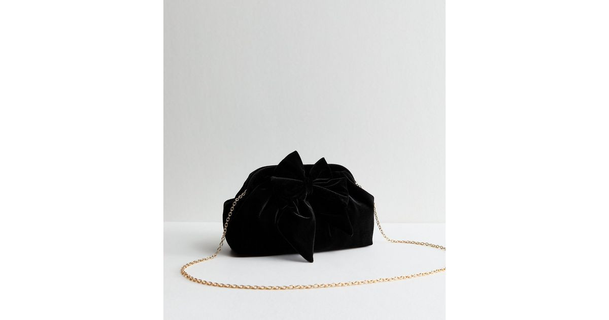Black Bow Applique Velvet Slouch Clutch Bag | New Look | New Look (UK)