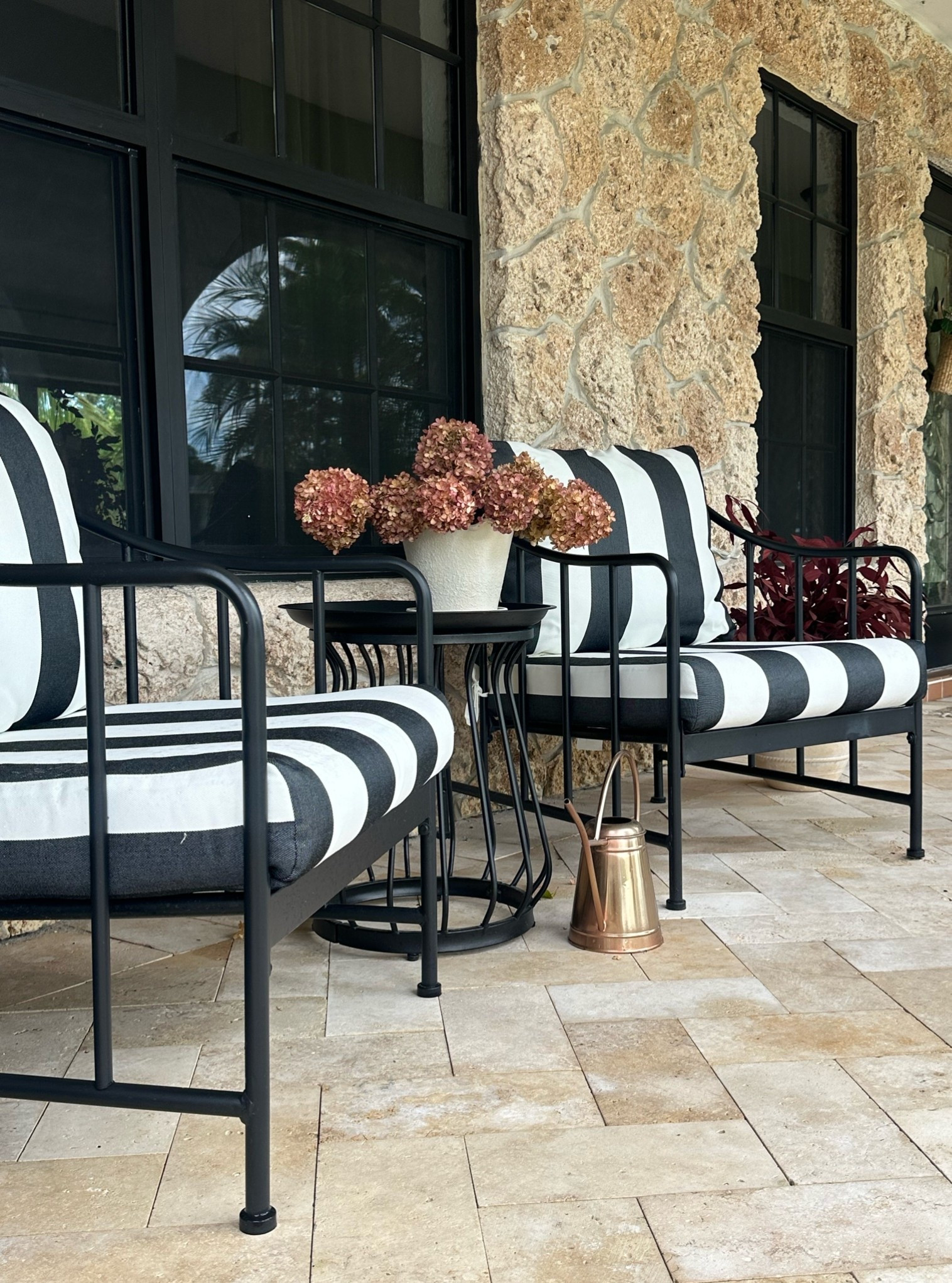 Front porch patio set ready for Fall! Striped cushions and moody Fall
Florals. 

Stone porch 
Fall decor 
Moody 
Patio set
Bistro set
Autumn
Hydrangeas 
Burgundy

#LTKSeasonal #LTKHome #LTKSaleAlert