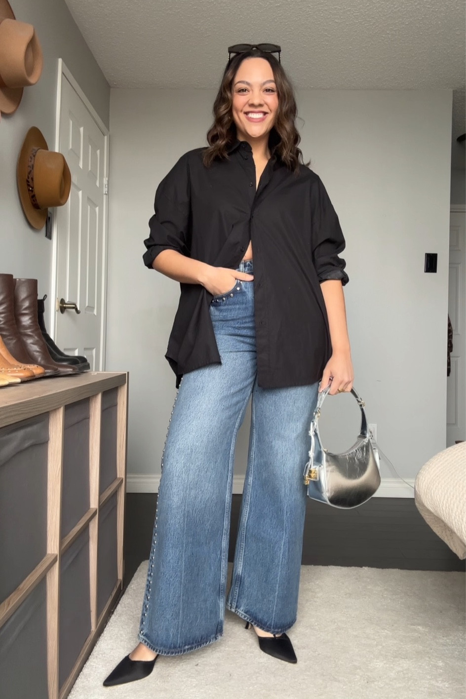 Spring going out outfit inspiration! Details below:
-Black oversized poplin button up shirt. Similar options linked. 
-Reformation medium wash wide leg studded jeans. I have a size 29. Similar jeans also linked. 
-Silver Ganni shoulder bag. Similar option linked.
-Reformation black kitten heels. Fit true to size. Similar option linked. 
-Celine Triomphe sunglasses. 


#LTKstyletip #LTKitbag #LTKSeasonal