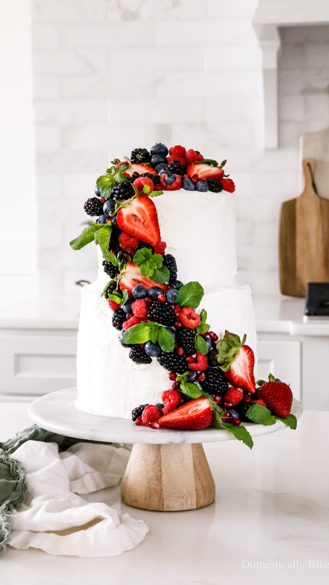 A Frosted Watermelon Cake made of only watermelon and decorated with homemade whipped cream and lots of fresh fruit.

See recipe:
https://domesticallyblissful.com/frosted-watermelon-cake/

🔗 Join our newsletter: https://domesticallyblissful.com/newsletter/ 

#LTKParties #LTKSeasonal #LTKSummerEdit