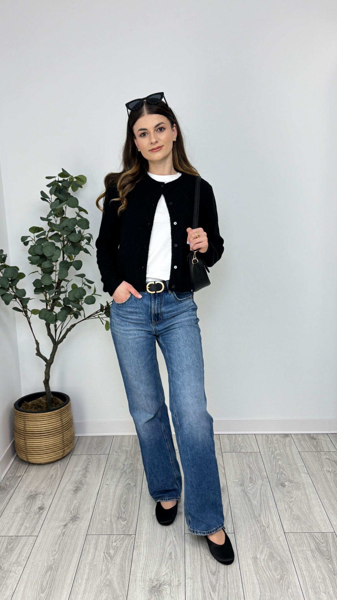 Blue straight-leg jeans meet a white tee and a timeless black cardigan for a crisp, clean combo. Finished with black ballerina flats, a structured purse, and subtle gold accessories—classic with a modern twist 🦋 #IlaStylesDiary 

#LTKworkwear #LTKspring #LTKeurope
