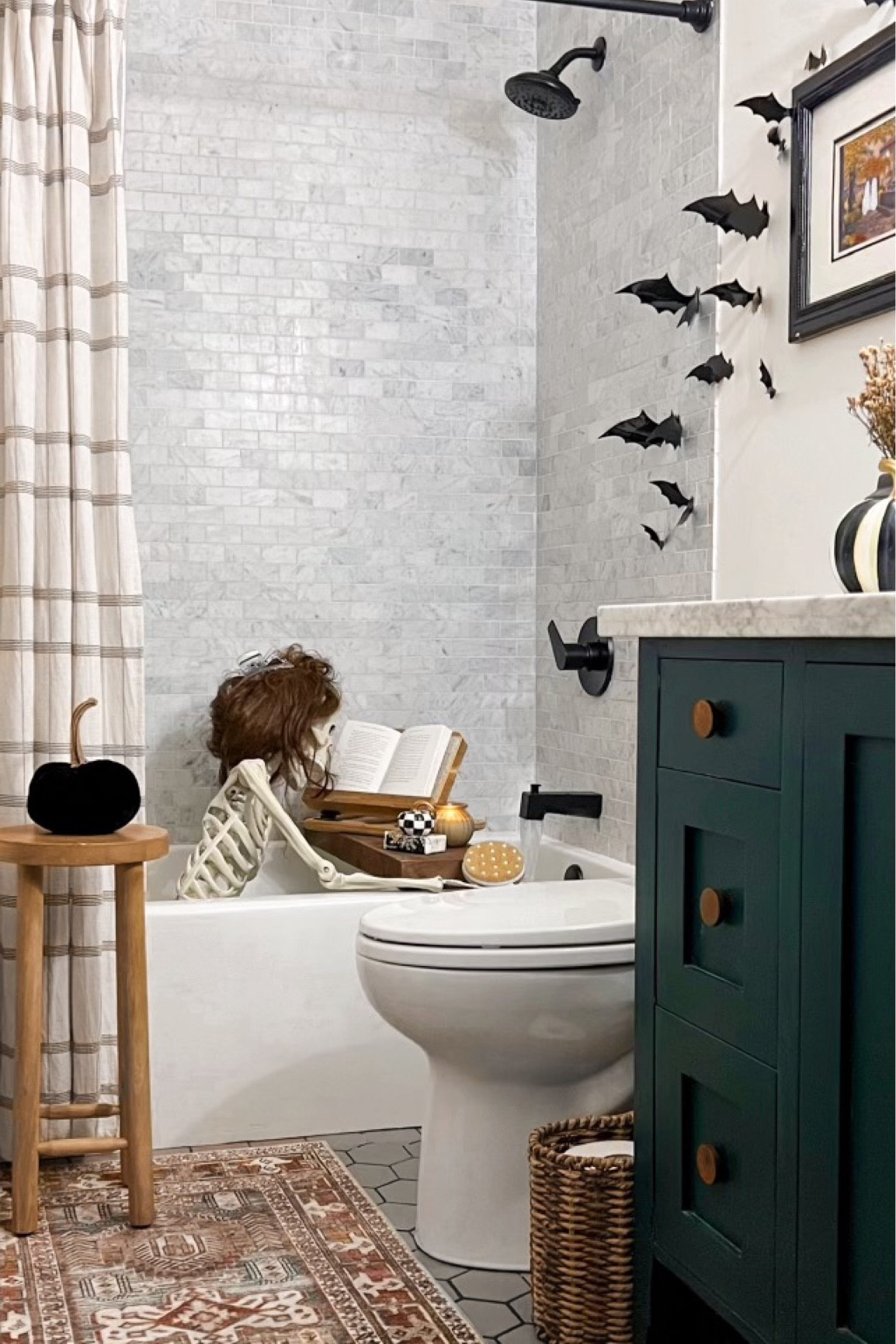 Halloween bathroom officially spookified with the help from Jane Bones Jovi! 💀🧡 I mostly shopped my house to get this simple look… plastic bats, thrifted ghost art, velvet pumpkins, dried florals from Trader Joe’s and of course all the goodies for a nice hot bath (book stand, pumpkin candle, bath salts and a good scrubber.) Get this look to make your own bathroom a little spookier this time of year! 

#LTKHoliday #LTKHalloween #LTKSeasonal