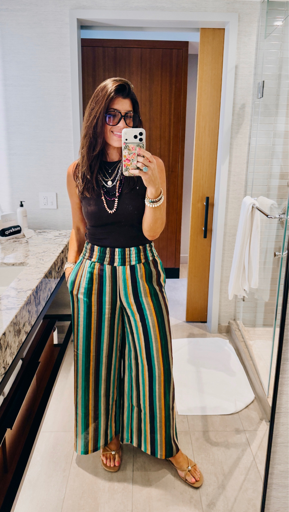 In a medium tank
Medium tall linen pants

#LTKMidsize #LTKOver40 #LTKSeasonal