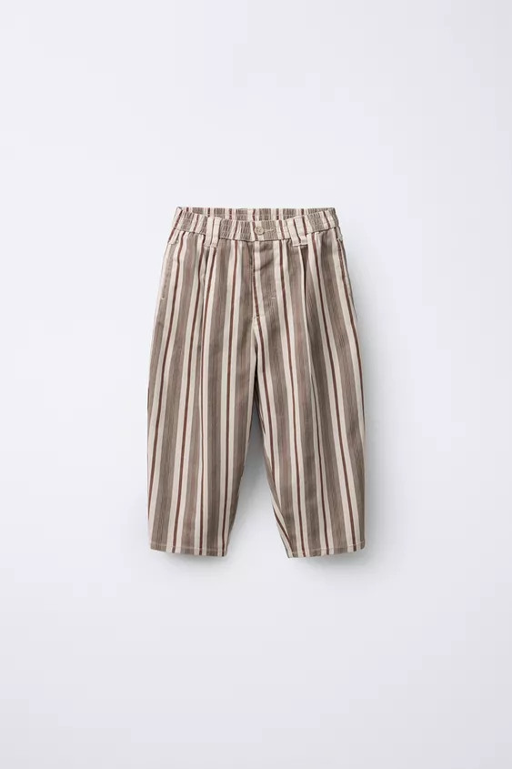 Baggy pants with elastic waistband and front button closure. Front pockets and back patch pockets... | Zara US