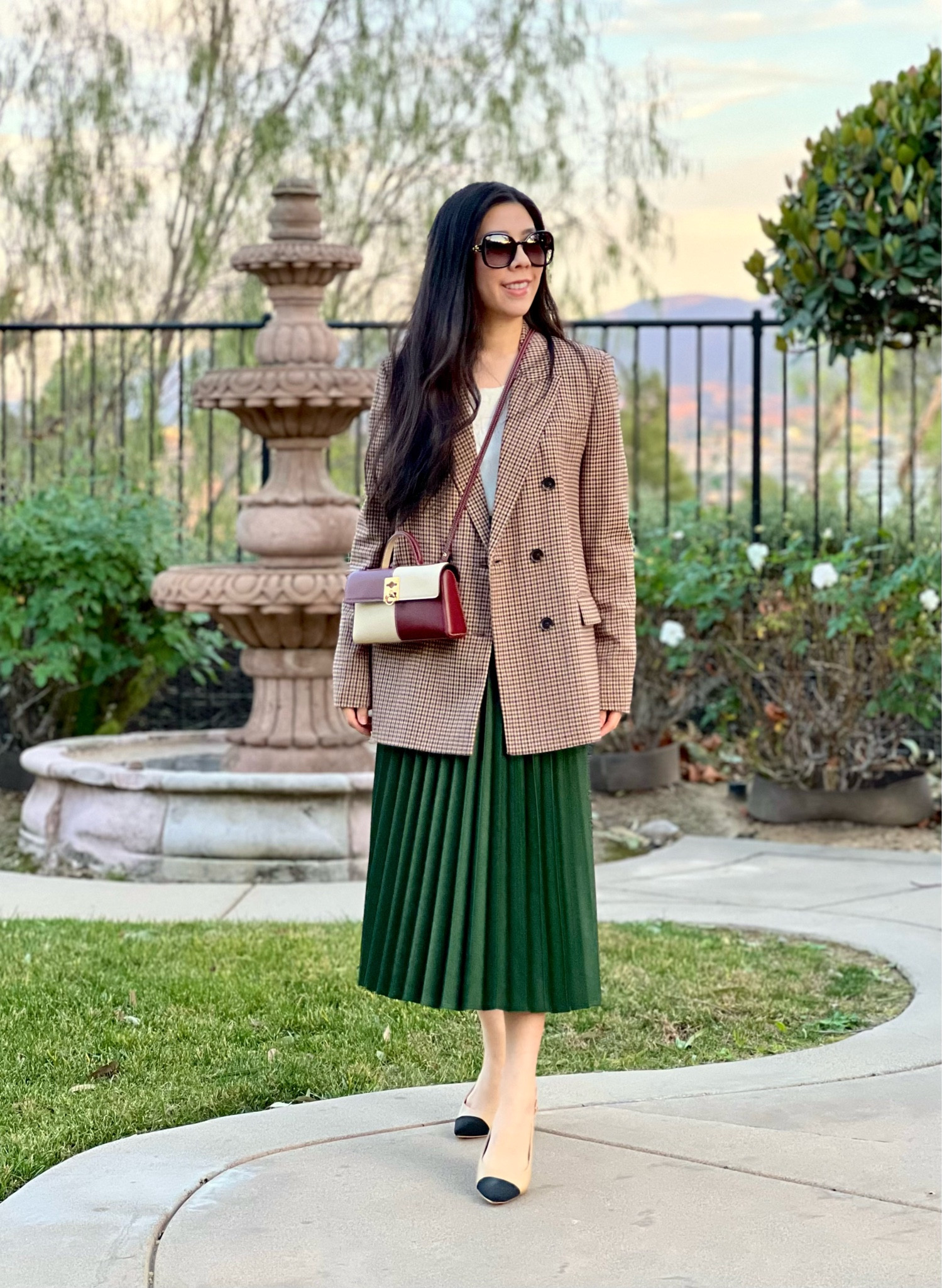 Whenever I’m looking for a comfortable fit, I opt for oversized pieces. I’m pretty petite so I tend to avoid really big items however sometimes the day calls for a loose fit. I paired my oversized double breasted plaid blazer on top of my high waisted pleated leather midi skirt. There are merlot and burgundy details on my blazer so I wore it with my Merlot and eggshell crossbody bag! Since things were already a bit busy on top, I kept it simple with my two-toned pointy slingbacks.

#oldmoney #plaidblazer #pleatedskirt #leatherskirt #classystyle #preppystyle #classyshoes #doublebreastedblazer 

#LTKSeasonal #LTKPetite #LTKStyleTip