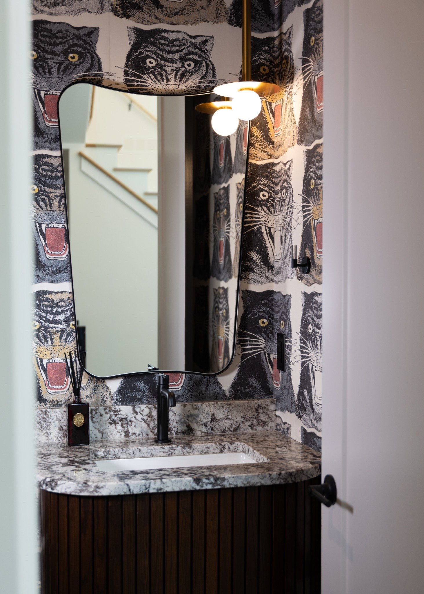 A memorable modern powder bath with a fun tiger head wallpaper. 

#LTKStyleTip #LTKHome #LTKSeasonal