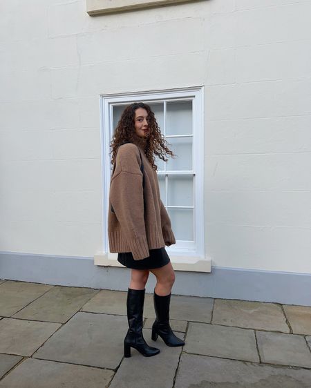 Brunette female wearing an oversized brown sweater, leather mini skirt, leather knee high boots and leather bag standing in front of a wall with brown long curly hair! ❤️

Jumper size L
Skirt size 8
Boots - ususal size

#LTKfindsunder100 #LTKMostLoved #LTKSeasonal