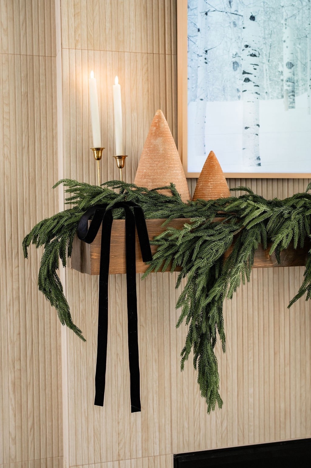 A dreamy little Christmas detail ✨ The mix of lush faux affordable Amazon greenery, warm taper faux flame candles also from Amazon, and sculptural holiday trees adds texture without overwhelming the space. Beautiful inspo for holiday mantel styling, organic Christmas decor, cozy winter accents, minimal Christmas decorating, and neutral holiday styling. 🌲

#LTKSeasonal #LTKHome #LTKHoliday