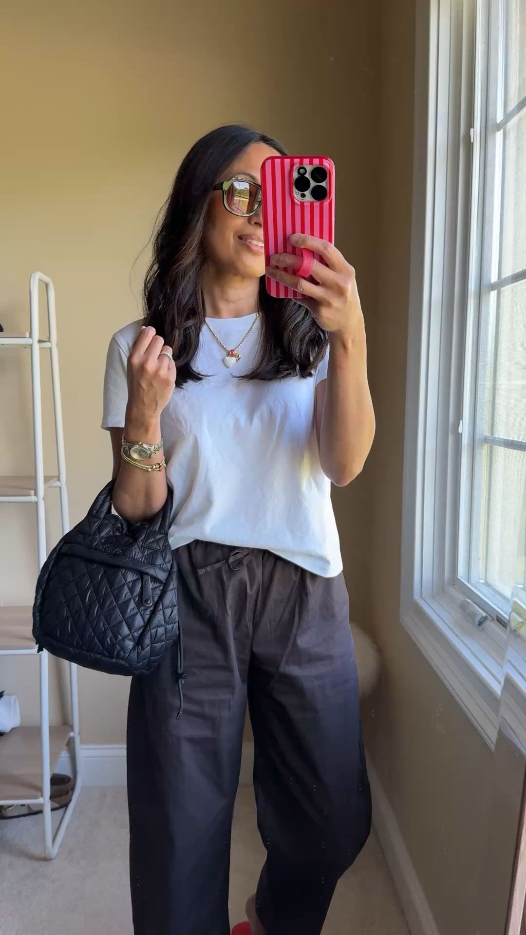 What I wore today: Summer pants outfit. 
- I added a pair of pull on cotton poplin pants to my closet this year and they are becoming my go-to bottoms when it’s not a shorts day. So easy and comfy. I sized down in exact pair. 
- A favorite t-shirt of all time. All cotton. And the fit is great. I wear true to size and a size up for different outfits. 
- Pop of color. I’m liking red a lot this season.  Linking options for red flip flops. 
- Sunglasses are comfortable and look chic. 
- Some favorite summer jewelry: charm necklace and barcelets.

#LTKOver40

#LTKootd