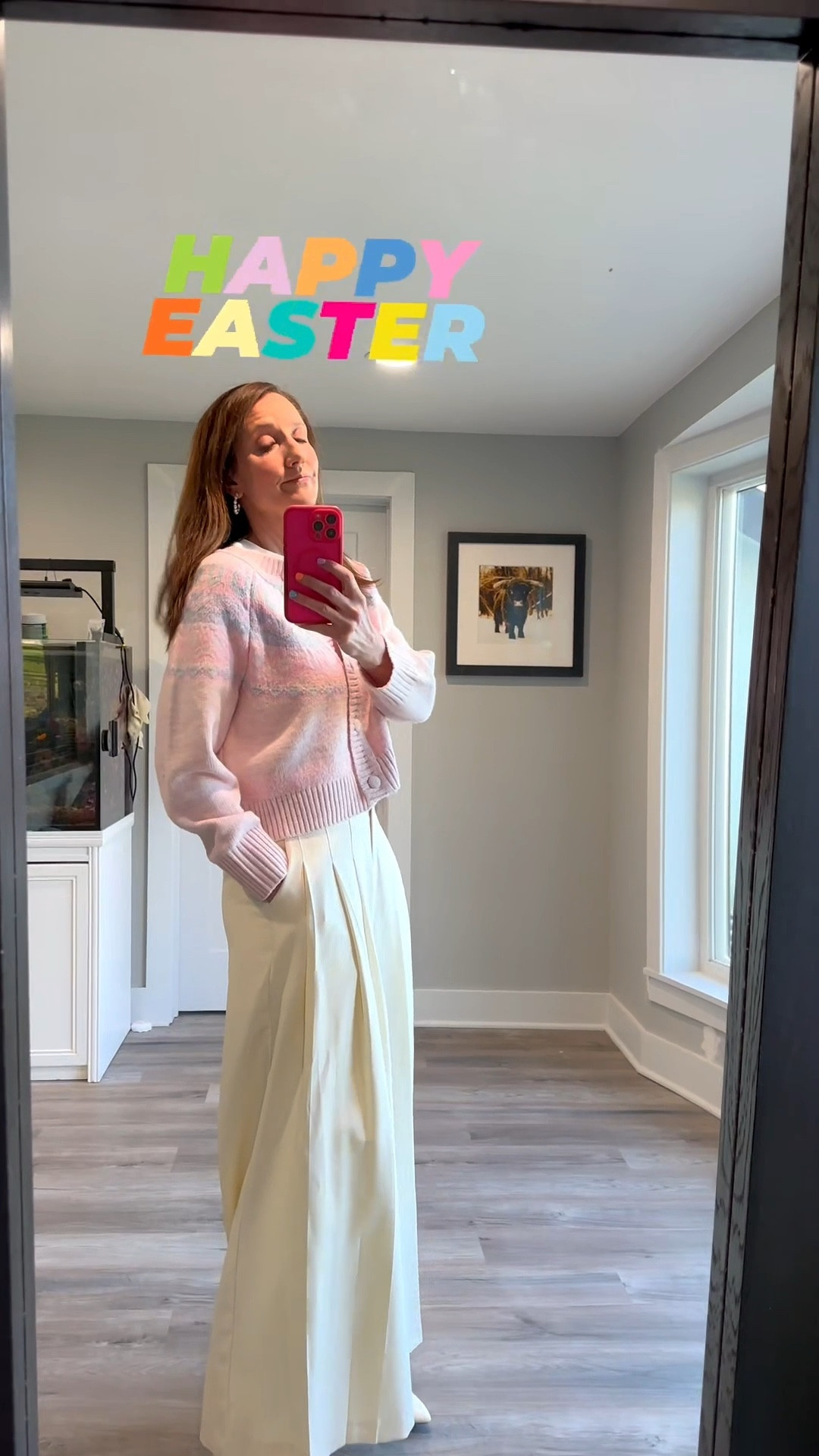 Happy Easter! 🐣✨ There is nothing quite like a soft palette of pink and cream to celebrate a beautiful spring morning. I wanted to wear my spring stripe colored dress, but it is too cold today, so I went the warm route. I’m love how these voluminous pleated trousers pair with a cozy knit for a look that’s as comfortable as it is celebratory. Tap the link in my bio to shop my Easter Sunday outfit and see more of my favorite seasonal layers! #EasterSunday #SpringStyle #PastelAesthetic #ShopTheLook

My Easter Pastels Style Breakdown
• The Top: I’m wearing a cropped, button-front cardigan in a soft baby pink with a subtle lavender and white geometric pattern across the chest.
• The Pants: I paired the knit with high-waisted, cream-colored wide-leg trousers featuring dramatic front pleats for a tailored, high-end silhouette.
• The Footwear: I finished the look with sleek white pointed-toe ankle boots to elongate the leg and keep the palette crisp.
• The Details: My multi-colored pastel nails add a festive, playful touch that perfectly complements the holiday energy.
• The Vibe: This outfit is the definition of "spring elegance"—it captures a fresh, organized energy that's ideal for Easter celebrations or a garden party.

pink cardigan, patterned knit sweater, cream wide leg pants, pleated trousers, white pointed toe boots, Easter Sunday outfit, spring pastel look, feminine holiday style, effortless elegance, high waisted pants, LTKstyle

#LTKOver40 #LTKmomlife #LTKSeasonal