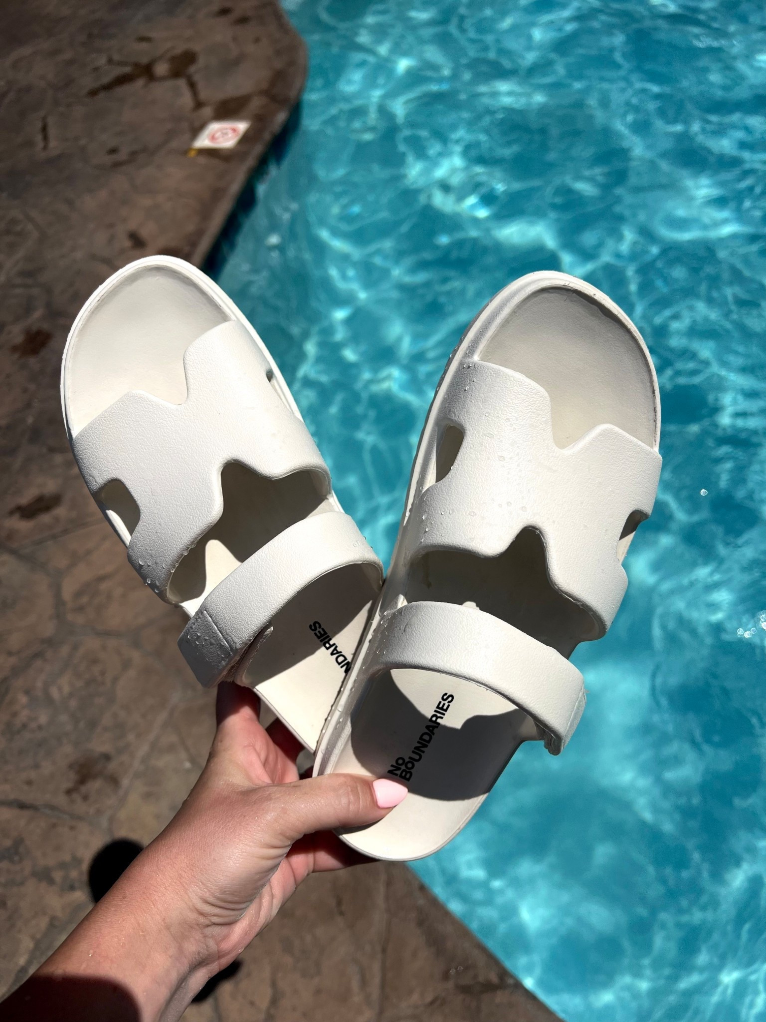 Obsessed with these waterproof slides. I went up a size and they are perfect with the adjustable strap. Comes in a ton of fall colors too! 