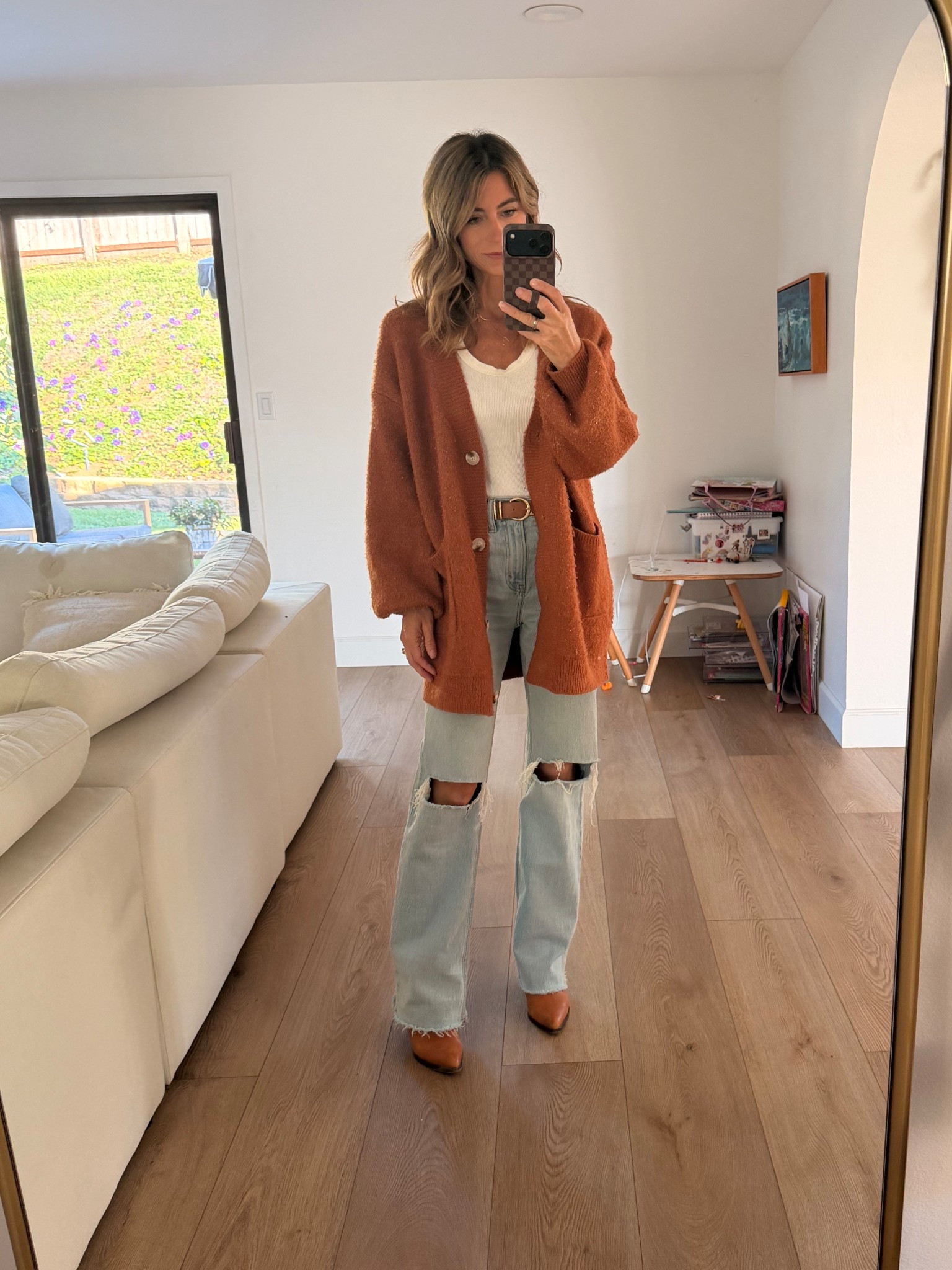 Shopped my closet today! Fall colors. Wearing some old & some new! Cozy fall was the vibe… but now it’s 75 degrees here 😅 definitely stock up on these tank tops!!

Relaxed fit jeans, oversized sweater, oversized cardigan, brown belt, brown boots, loopy case, phone case, white tank top, cardigan, family photos 

#LTKOver40 #LTKSeasonal #LTKStyleTip