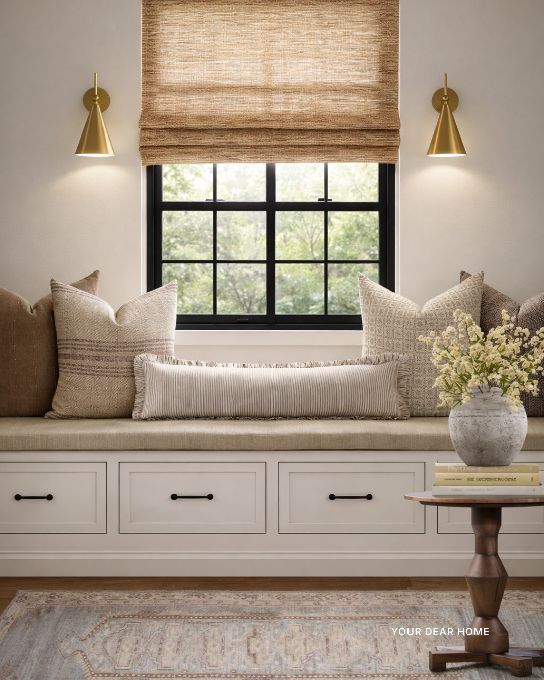 If you love warm neutrals but don’t want your space to feel flat, this is the formula.

Layer different shades of brown and beige, mix subtle patterns, and anchor it with a vintage-inspired runner to pull everything together. The tailored Roman shade and brass sconces keep it polished while the textured pillows make it feel lived in. 

 #LTKHome