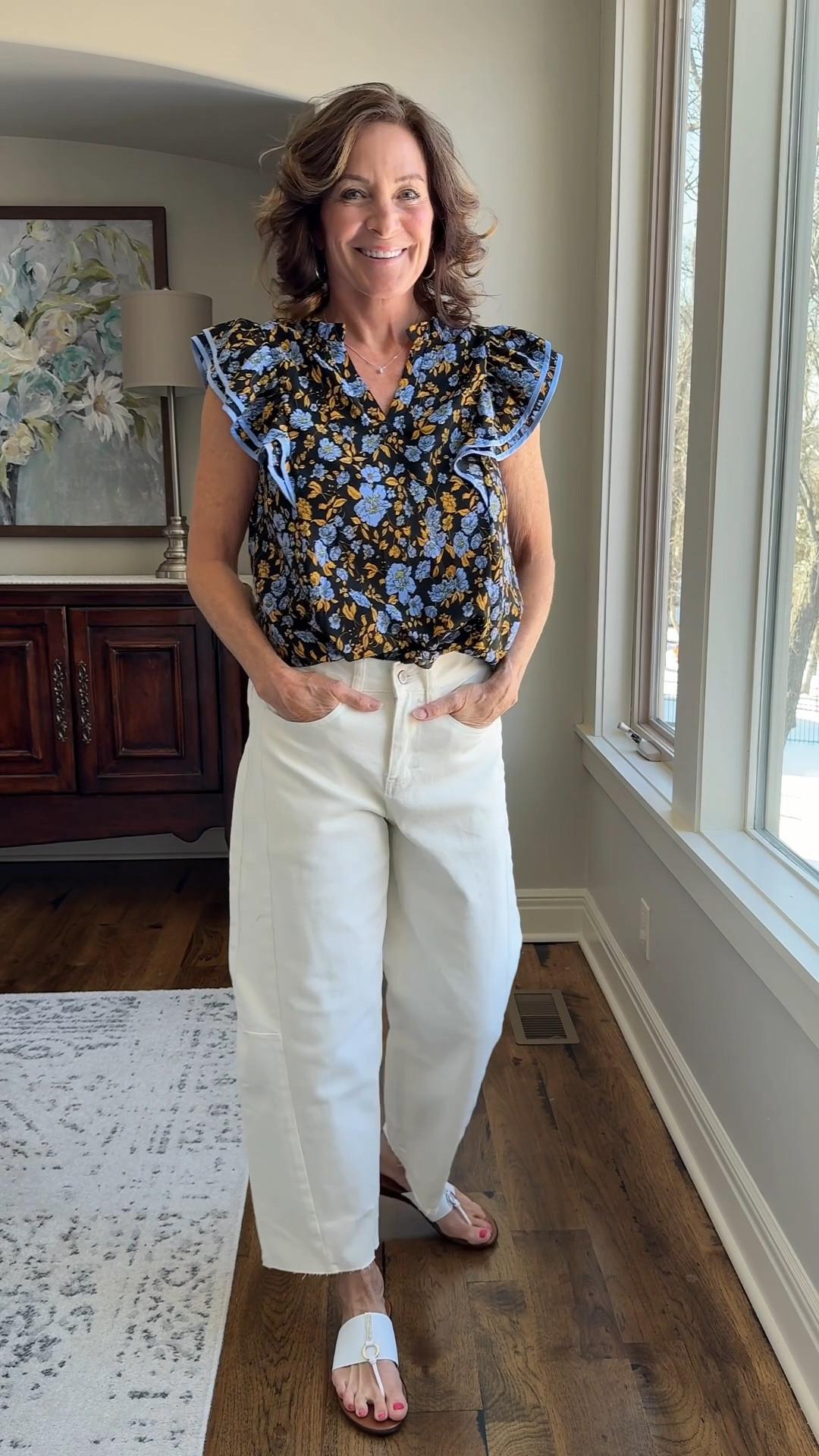 This top is such an easy win. The ruffle detail adds interest without feeling fussy, and the fit is relaxed but still polished. I love it with white jeans for spring — effortless, comfortable, and flattering. Definitely one I’ll keep reaching for.

#springtop #floraltop