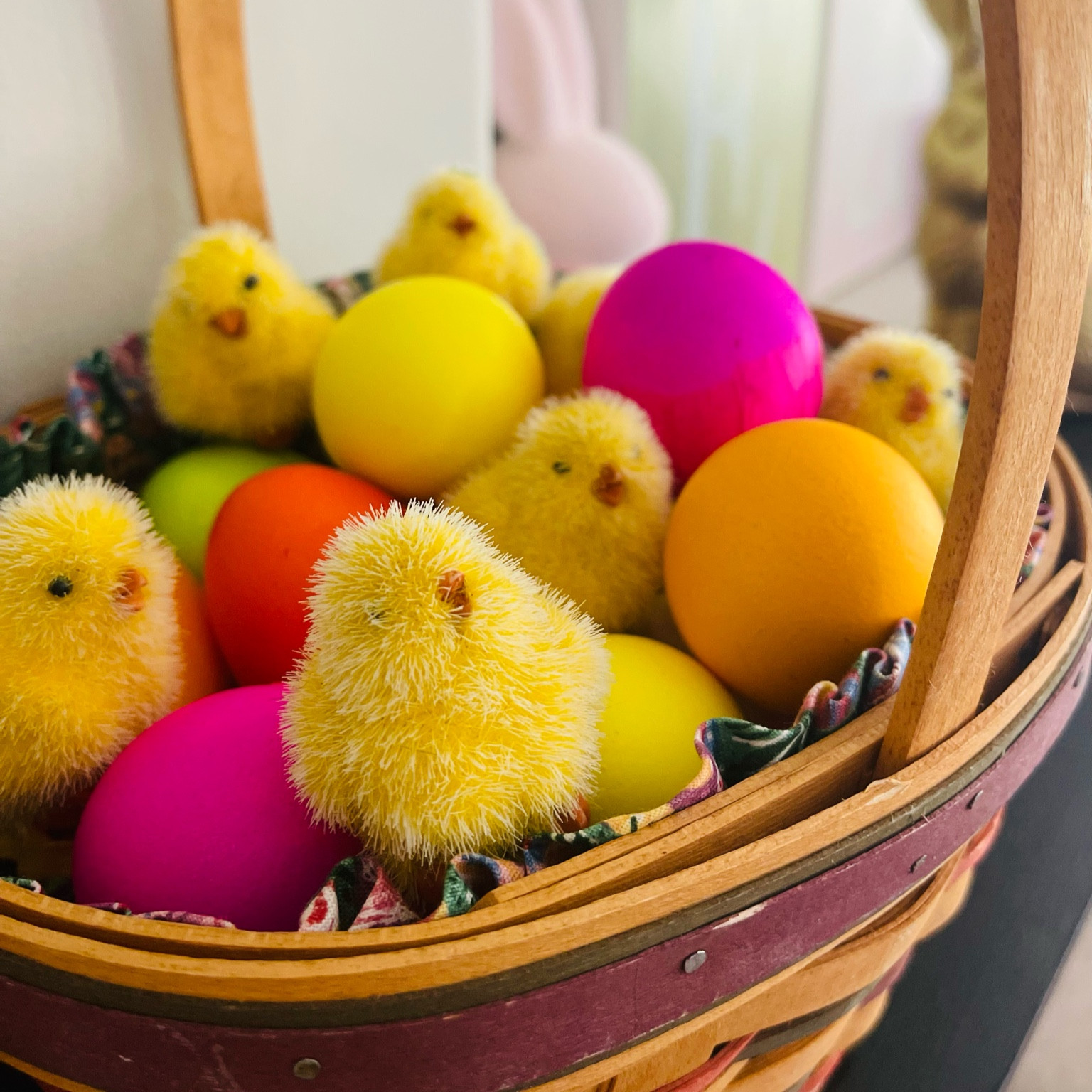 Easter Basket Decor with colorful confetti eggs and fuzzy chicks. You can also use wooden or ceramic eggs. I’ve linked some options for you. My basket is a collectible Longaberger basket but I found a couple nice wicker basket options for you. #easterbasket #easterdecor #potterybarn #amazonhome 

#LTKhome #LTKsalealert #LTKSeasonal