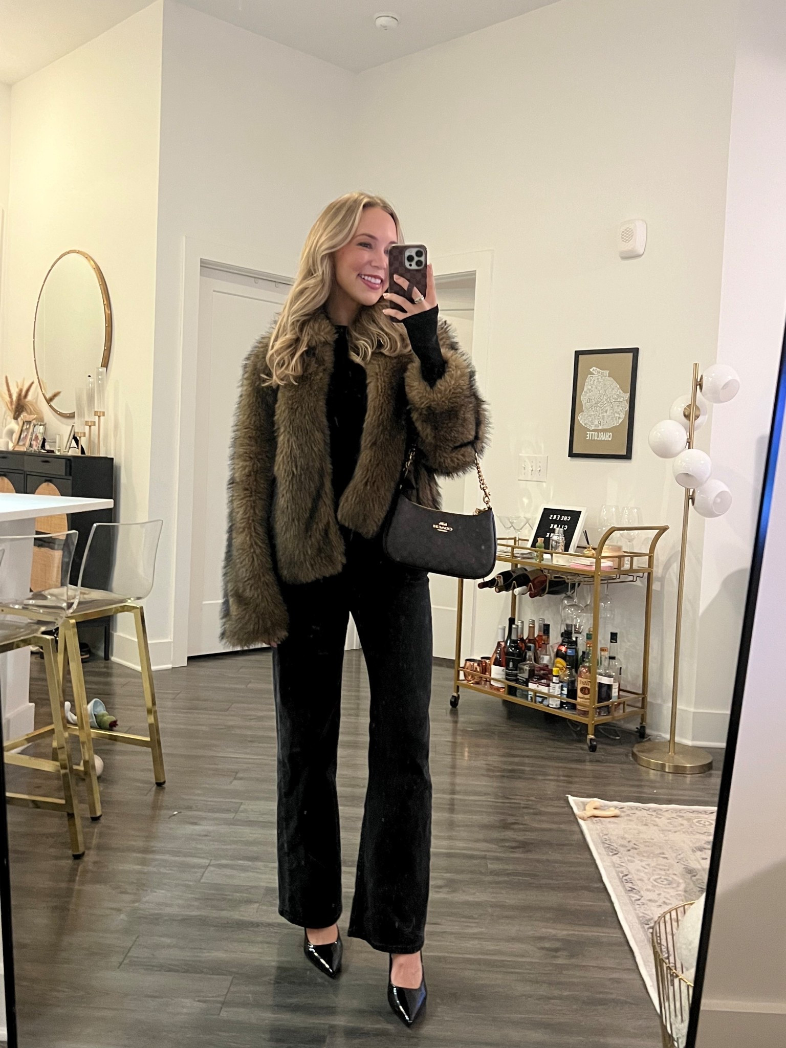 Winter outfit, girls night out outfit, black straight leg denim, black heels, black long sleeve top, faux fur coat, coach handbag 

#LTKdayinmylife #LTKgrwm #LTKSeasonal