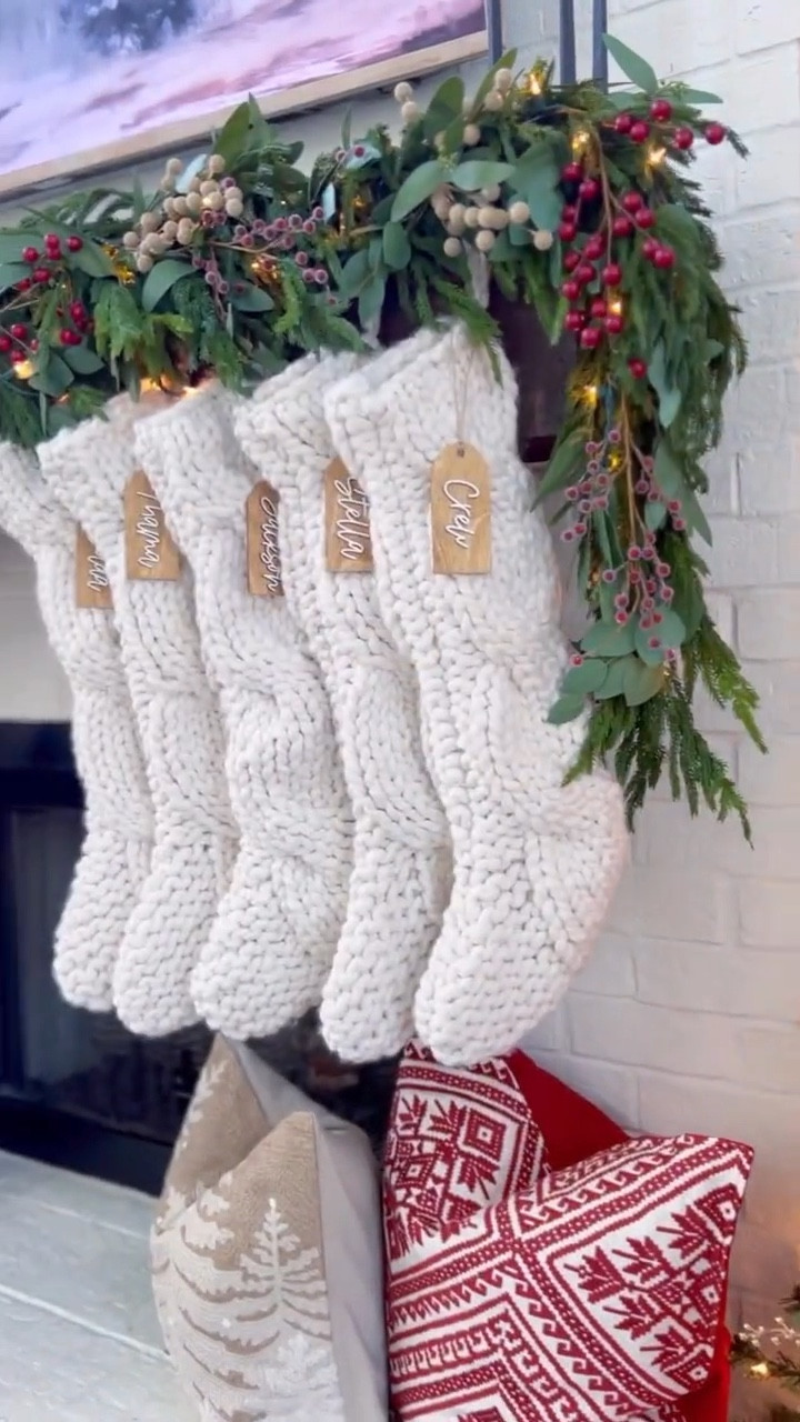 If you’ve seen my stories, you know we’re going a lot more merry and bright and all things color🎄this year so I thought I’d share this again for those who like to keep it a little more neutral with maybe a pop or two of red. I loved this mantle styling so much! Here’s how I did it:

1. I hung my stockings first using flat stocking hooks that sit on top of the mantle. They’re low profile and the garland can drape over the top of them. Don’t forget stocking tags!

2. I used real touch Norfolk Pine Garland. I used one 8’ foot deluxe strand and four 6’ foot regular because this is just what I already had. You can’t get this look without layering multiple pieces of garland (which adds up unfortunately) but the deluxe is really full, so it will take less if you use that! Also this garland is amazing quality and will last for years! My mantel is rough so I use nails to hang my garland, but there are lots of command hook options that work well too!

3. If you want lights in your garland, this is the time to weave them through before you start adding anything else! I just wrapped warm white lights around the garland. Twinkling or fairy lights work well too!

4. I love mixing greenery so I added eucalyptus this year. I deconstructed my seeded eucalyptus garland and just stuck the picks right in to the Pine Garland. I used two strands of eucalyptus to fill in mine. 

5. Next I added in berry picks. I used matte red, frosted red, and frosted gold! Mine are from Hobby Lobby.

6. I added a strand of vintage bells…these will never go out of style in my opinion! You could also add velvet ribbon!

7. I finished decorating the fireplace by adding flameless candles and candlesticks, throw pillows, and beautiful birch trees! 

I loved adding in the pops of red and how it turned out! It was worth the effort it took to get here!😍

#LTKHoliday #LTKStyleTip #LTKHome