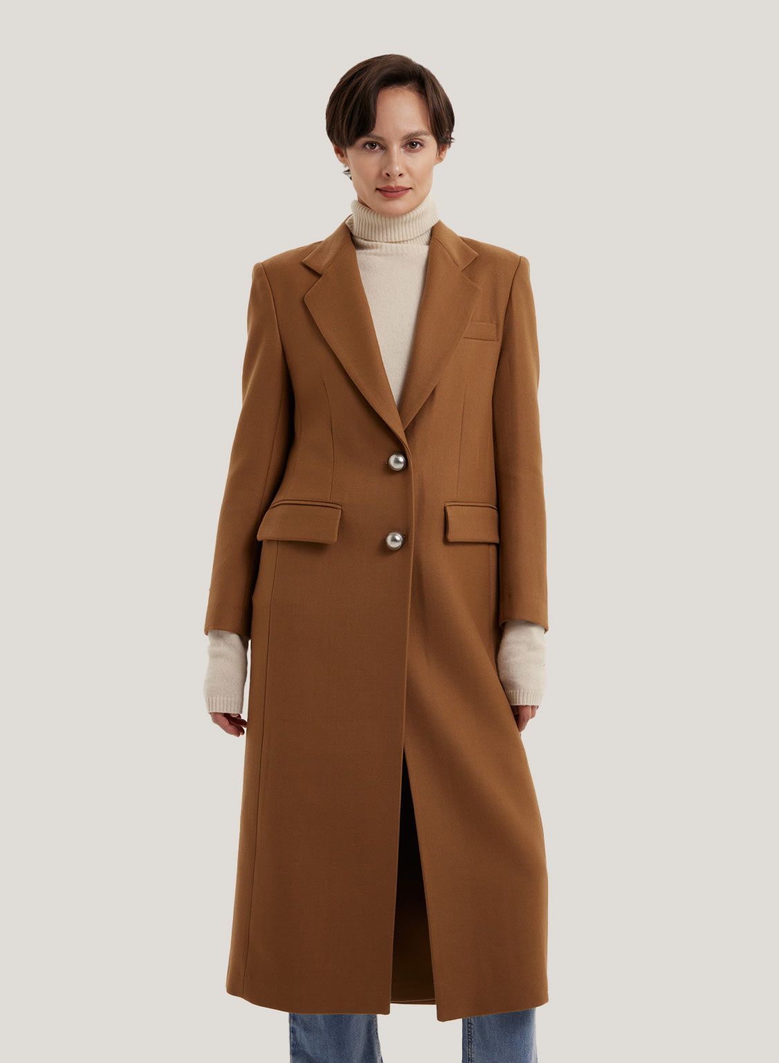 This long coat is crafted in pure wool with a slight cocoon silhouette and a fitted frame. Featur... | Gentle Herd