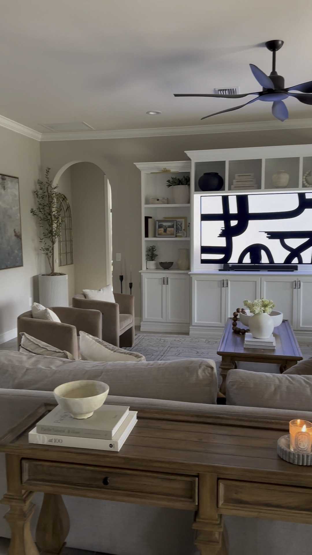 Living room details! This room has changed so much over the past couple of years. Shopping for a new coffee table to fit this room better! 

Shelf decor, Target chairs, Vernon chairs, barrel chairs, pottery barn vase, Orion bowl, olive tree, fluted planter, neutral decor 

#LTKhome #LTKunder100