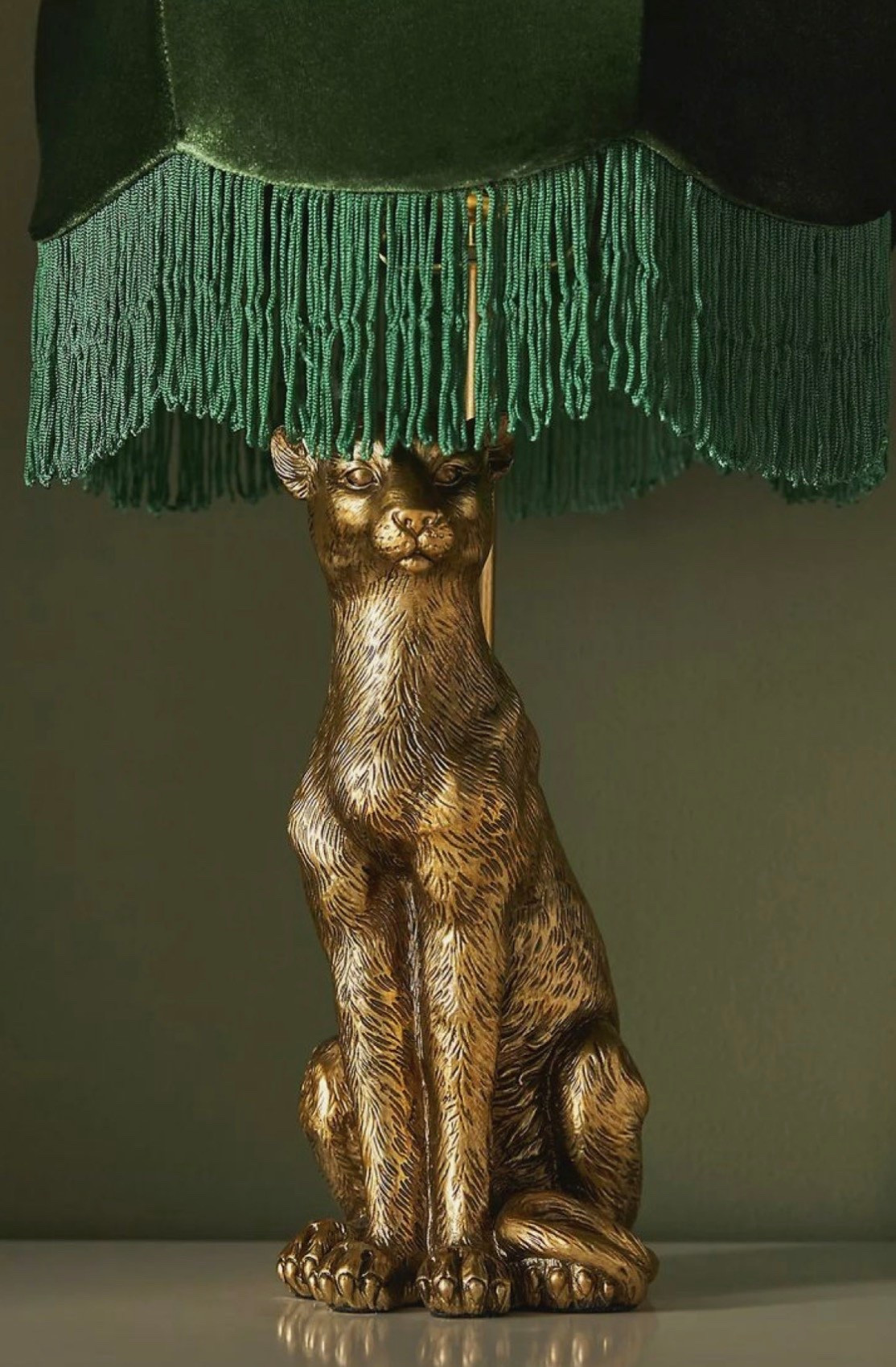 Statement lighting but make it art 🐆✨
This sculptural lamp is giving vintage glamour meets modern edge—rich textures, bold personality, and that deep emerald fringe? Unreal.
The kind of piece that instantly elevates any space… no styling needed.
Anthro really did their thing with this one.

Anthropologie leopard table lamp with emerald green fringe shade, featuring a vintage-inspired sculptural base in antique gold. Statement lighting piece perfect for eclectic home decor, maximalist interiors, and luxury vintage aesthetic. Ideal for living rooms, bedside tables, and curated spaces with bold textures and rich tones.

#LTKHome
