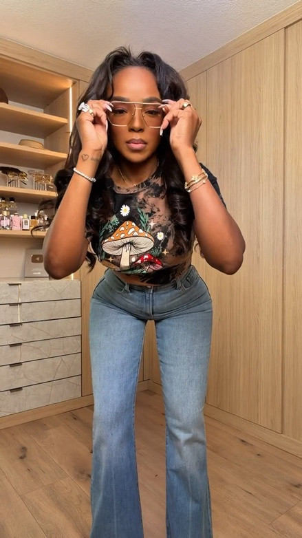Hi Babes!

This graphic tee and denim combo is proof that casual can still make a statement 🤎 The vintage-inspired mesh graphic top paired with light wash flare jeans gives that effortless cool-girl vibe while still feeling comfortable and wearable. The oversized glasses add personality and make the whole look feel styled instead of basic.

I love outfits like this because every piece can be mixed and matched with other staples in your closet, making it a great cost-per-wear purchase you'll reach for over and over again.

Perfect for:
• Weekend errands
• Casual lunch dates
• Coffee runs
• Travel days
• Concerts
• Shopping trips
• Everyday mom life

Everything is linked below 🤍

xx Kira | IG: KirasFashionFinds

34D - 27 - 40 • Size Small or 4