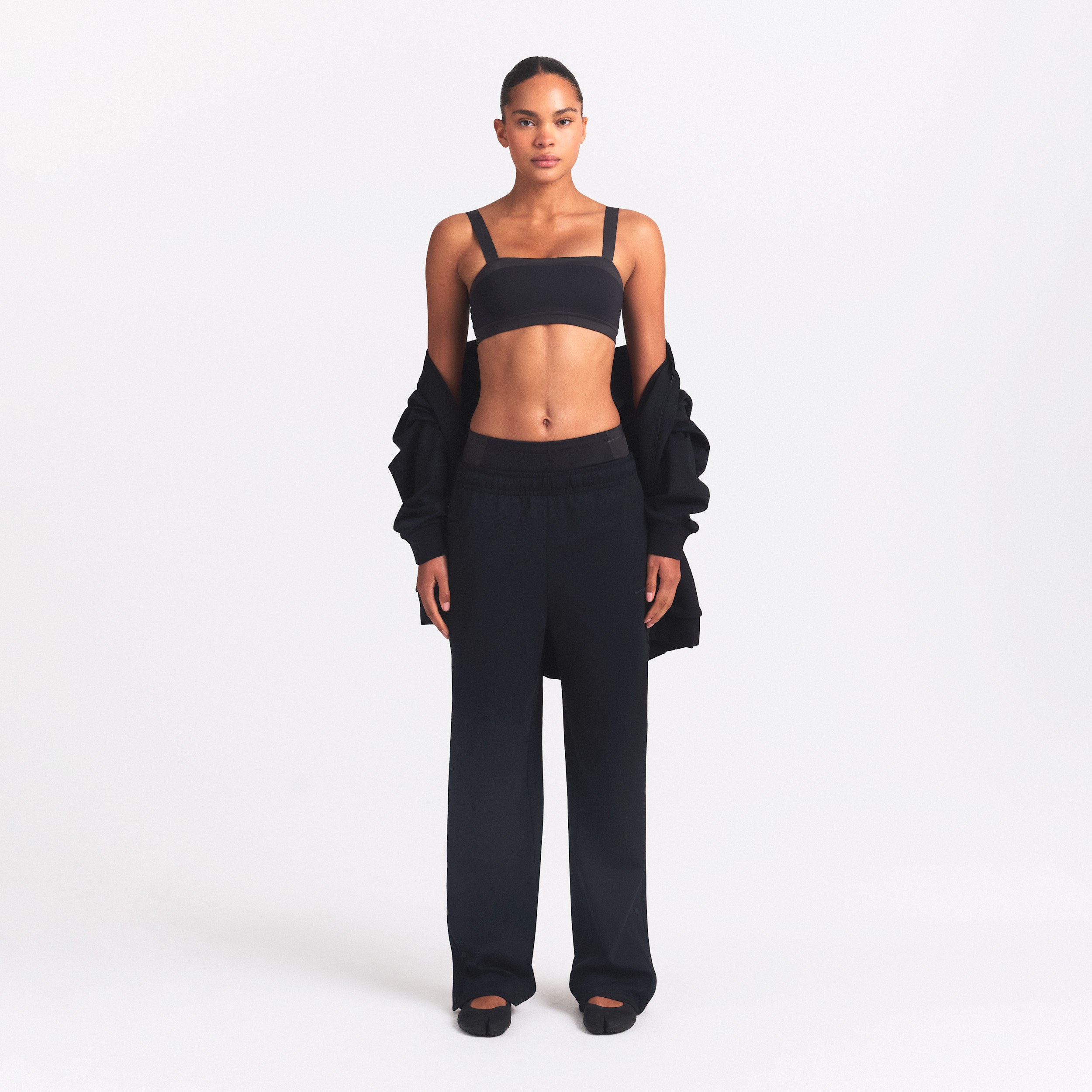 Nike Women's SKIMS Matte Tricot Side-Snap Pants in Black | BOWLG3533-OBD | Nike (US)