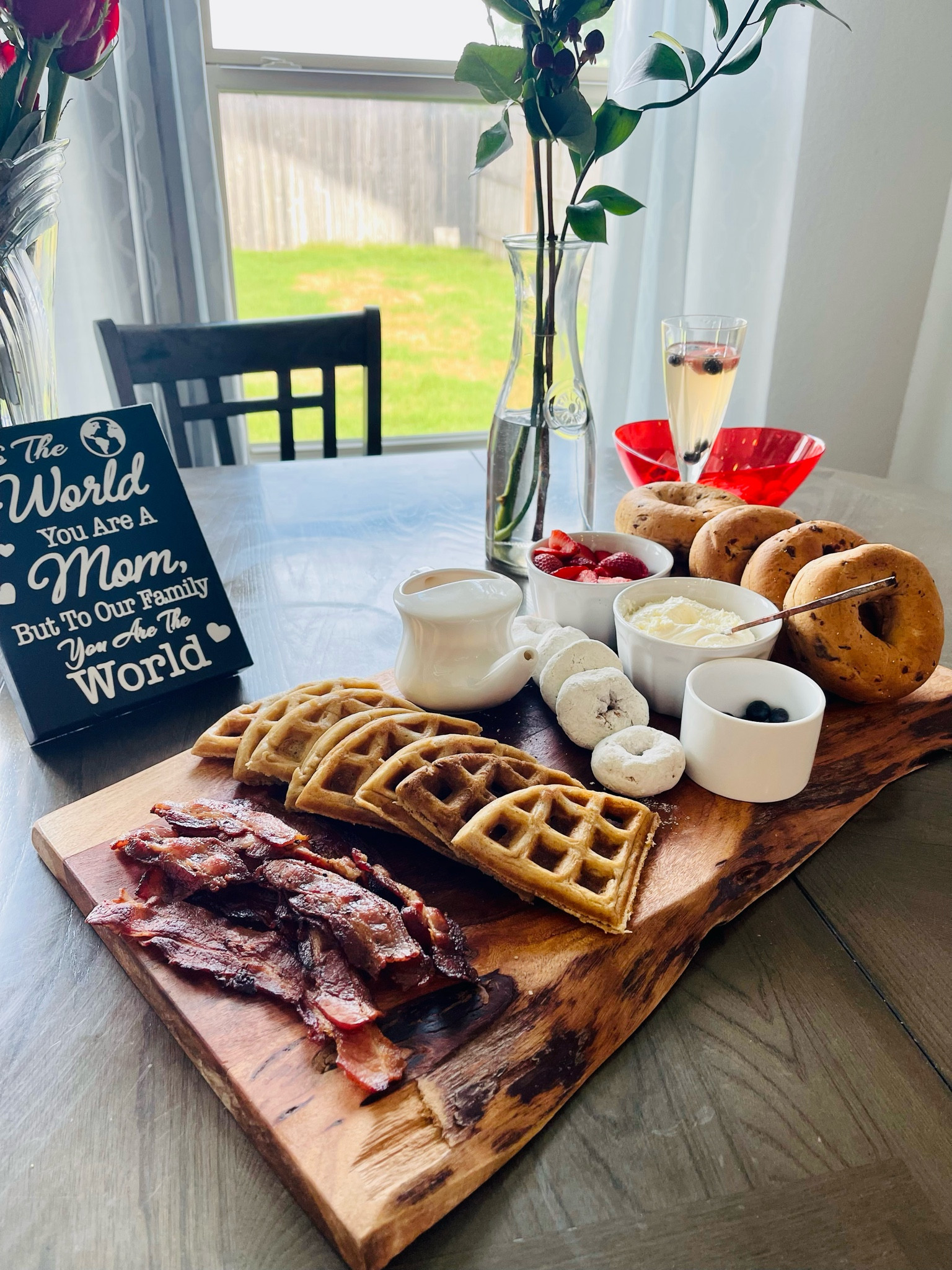 Mother’s Day brunch board! We made chicken and waffles topped with hot honey syrup, bacon, donuts, bagels and fresh fruit. And don’t forget the mimosas 🥂 

#LTKSeasonal #LTKparties #LTKhome