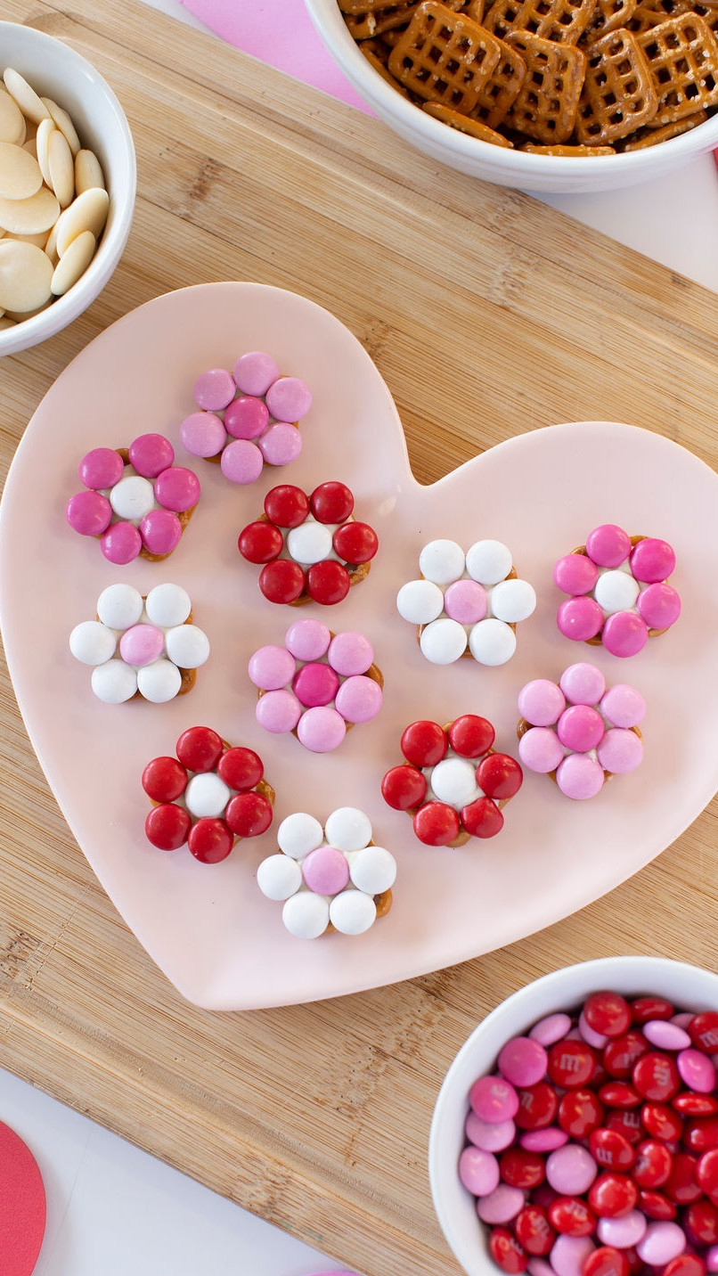 3 ingredient Valentines pretzel bites! ❤️🌸  PS. My Amazon Valentine's Day sweater is  under $15 and the full recipe for the cutest Valentine's Treats Ever is below! Shop all the ingredients below. 

Follow me @BestFriencsForFrosting for more easy holiday recipes! 

Cutest Valentine's Treats Ever! 

Valentine’s  Flower M&M Pretzel Bites 

Here's what you'll need:
❤️Butter snap pretzels
❤️Cupid's Blend M&M's
❤️White candy melts

Directions:
1. Preheat your oven to 225°F.
2. Line a baking sheet and arrange your pretzels.
3. Place a candy melt on each pretzel.
4. Bake for 3 minutes, or until the candy melts soften.
5. Create your flower designs with M&M's.
6. Pop them in the fridge for 5 minutes to set.
7. Share the love (or keep them all for yourself)! 😉


#valentines #easydessert 

#LTKSeasonal #LTKParties #LTKHome