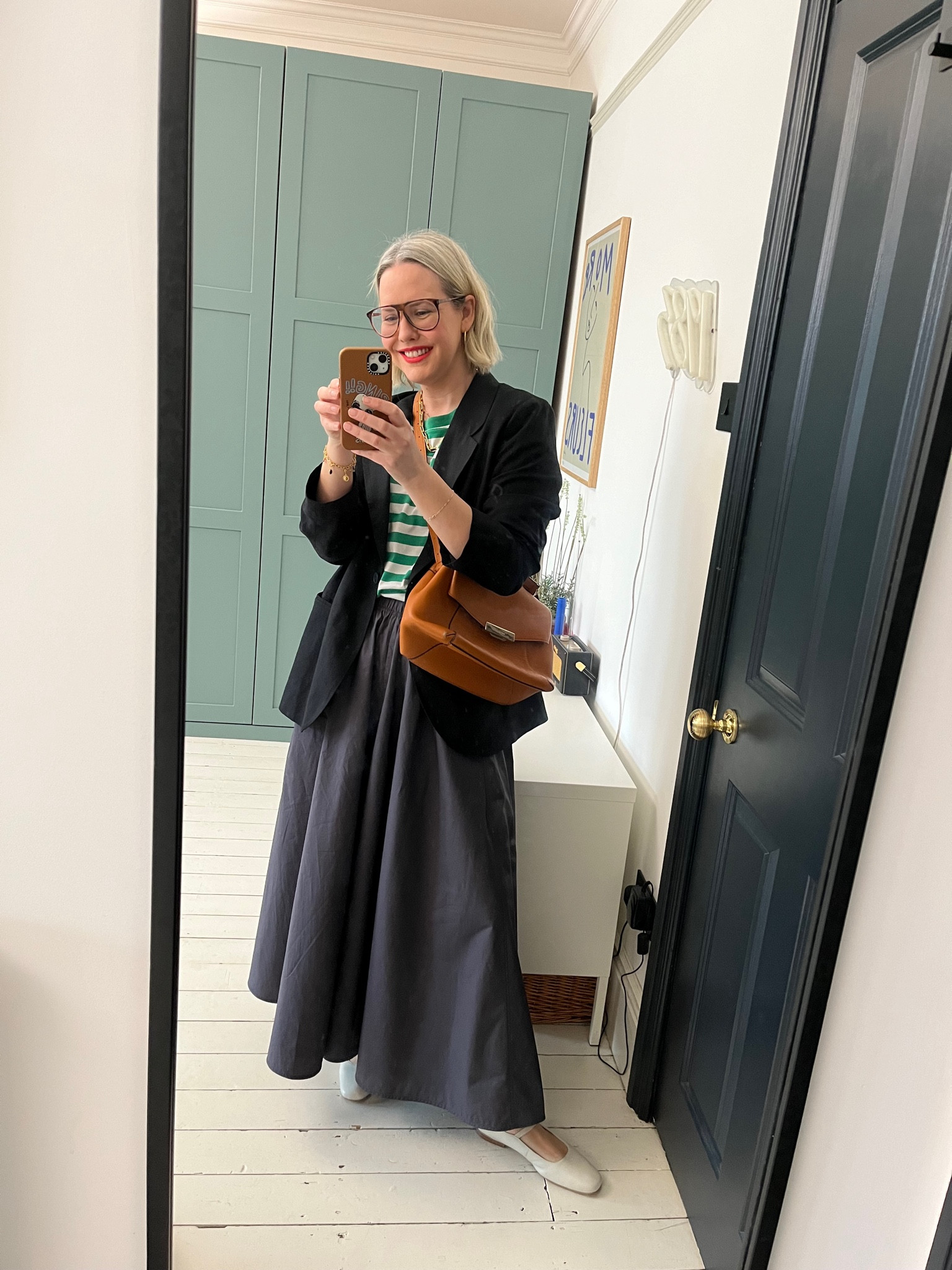 Striped long-sleeve top, Mary Jane Leather Pumps, Brown crossbody bag, A-line poplin skort, Oversized Blazer

#LTKstyletip #LTKSeasonal #LTKeurope