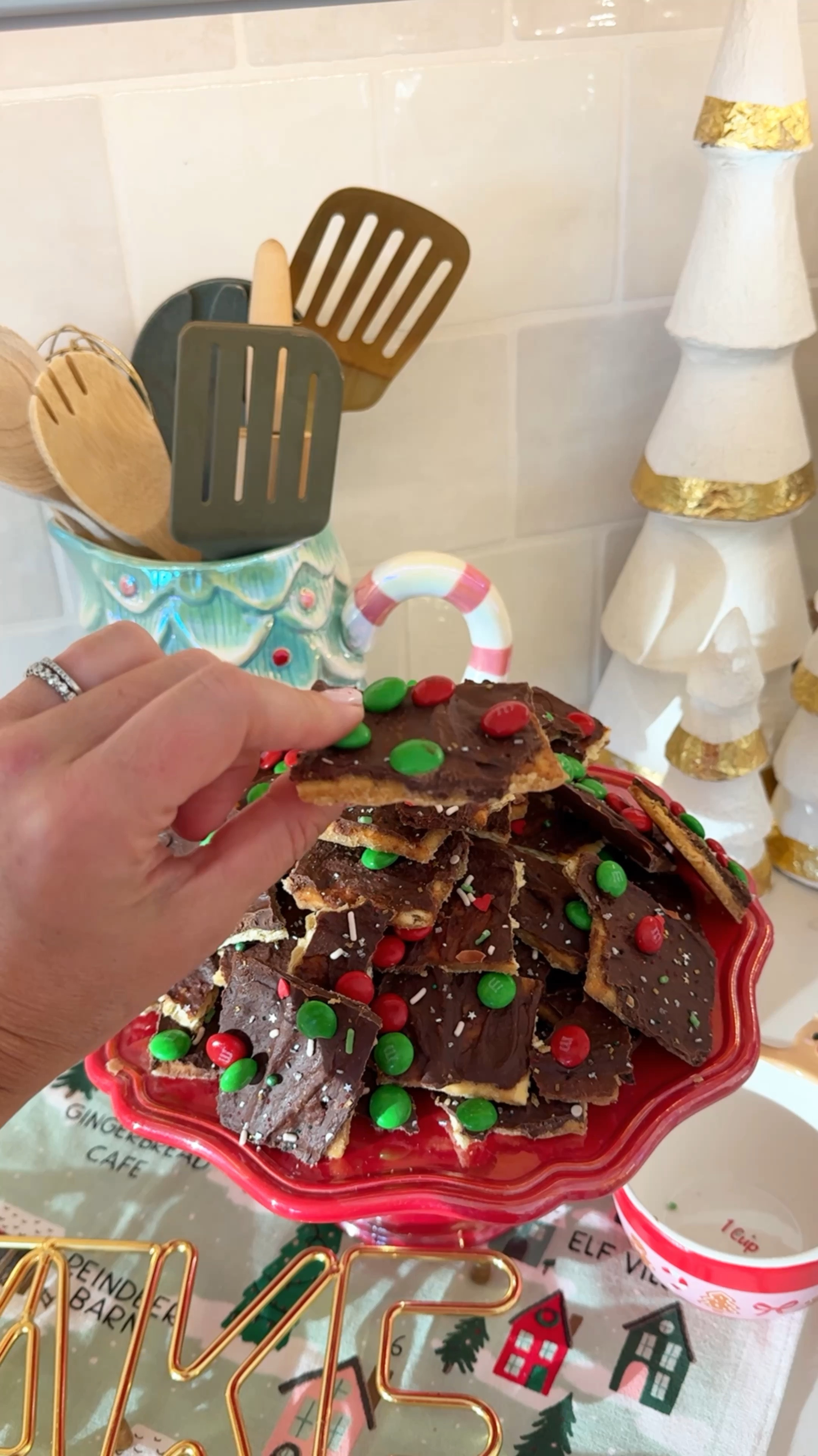 Let’s make Christmas ‘crack’ and yes, it is addicting! 

Pre-heat your oven to 325. On a large baking sheet, line with parchment paper and spray with cooking oil. Lay out lines of saltine crackers. In a saucepan on medium heat, add two sticks of butter (I used salted) and 1 cup of brown sugar, packed. Once melted bring up to a boil. This is the important part. Make sure to bring to a rolling/bubbling boil for 3 minutes so the sugar and butter fully combine. 

Pour over crackers and spread evenly. Pop them in the over for 5-7 minutes. Then, sprinkle on about 1 cup of chocolate chips. Let melt (you may need to pop it in the over for another minute) and then spread out evenly over crackers. Top with m&ms and sprinkles or whatever you’d like! 

Put them in the fridge to harden up for about an hour. After cooled, break apart pieces and enjoy! 

We’ll definitely be adding these to our must make list every season!

#christmascrack 

#LTKHoliday #LTKWatchNow #LTKSeasonal