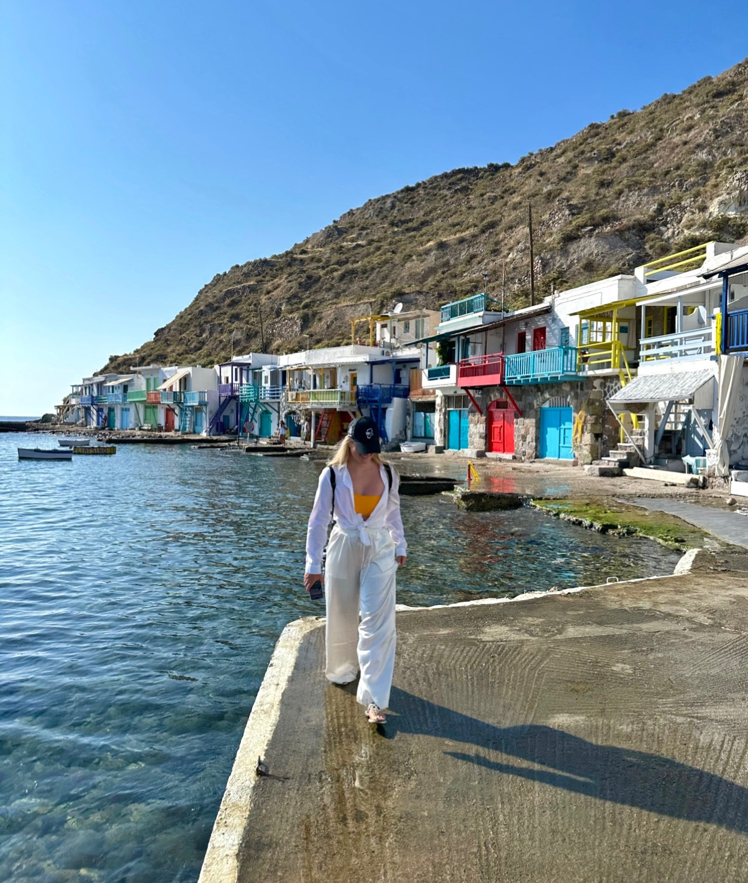 Milos - a magical little “Mamma Mia” town on the island of Milos in Greece. Orange bikini with white long sleeve set to protect from the strong UV on the island. 

#LTKswim #LTKtravel #LTKunder50