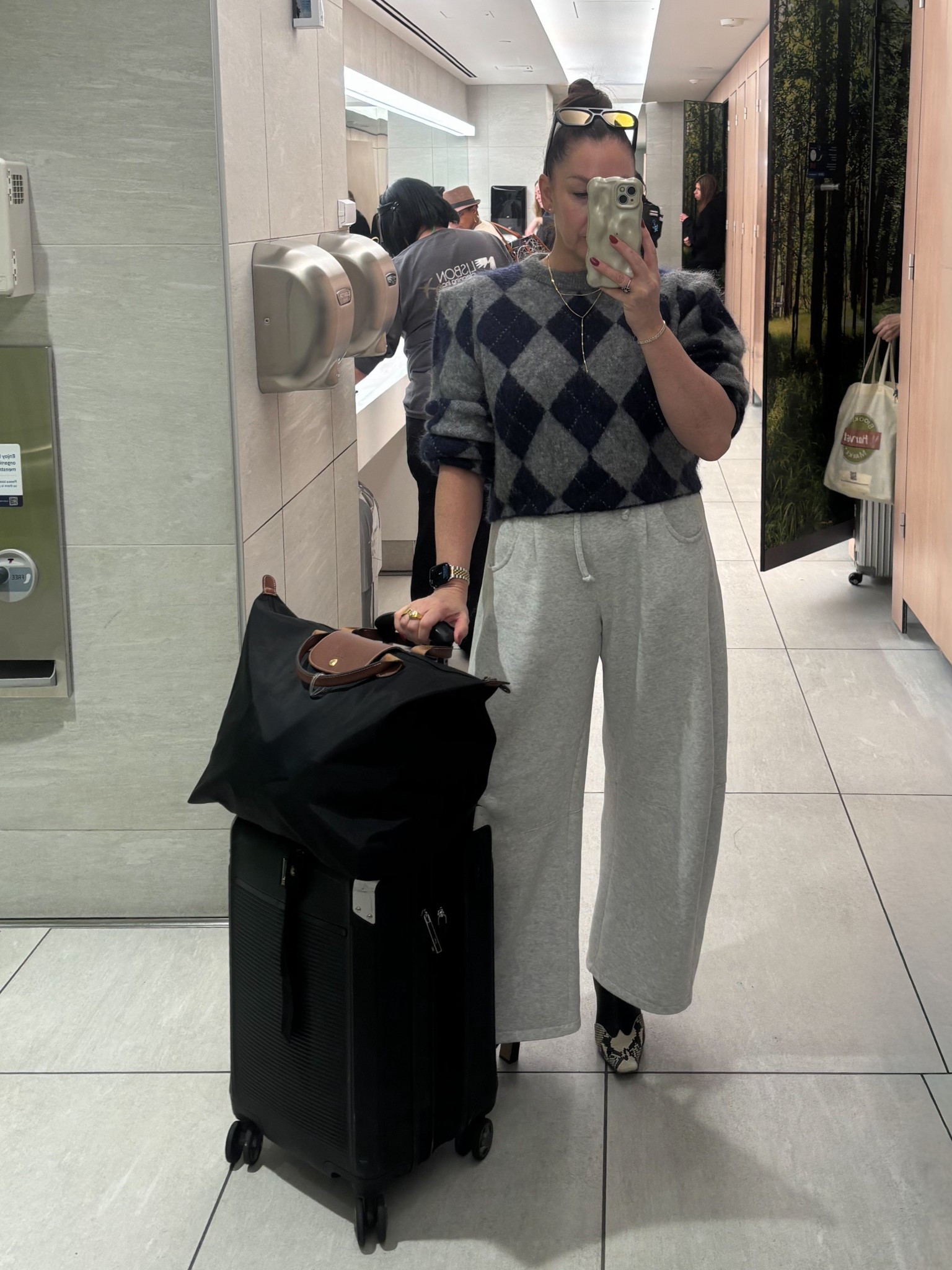 Nothing says chic travel outfit like an airport bathroom picture! Seriously though, these barrel leg joggers have been one of my favorite things I’ve bought this year and the argyle knit a close second! 

#travelputfit #travelstyle #airportootd

@travelpro 

#LTKTravel #LTKOver40 #LTKCyberWeek