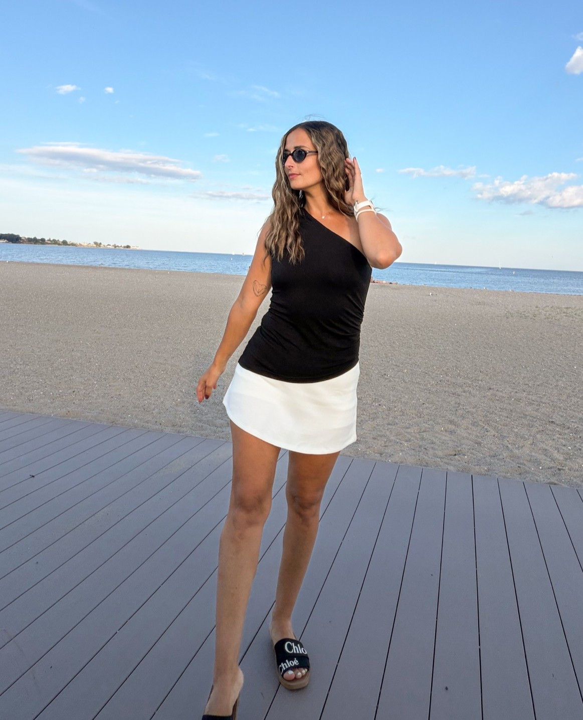 Can’t go wrong with black and white! Love this asymmetrical top I get SO much use out of it - I use nippie stickies underneath personally, and the white mini skirt is ACTUALLY a skort! Definitely recommend and will be buying in other clothes to transition into the fall with tights and sweaters

#LTKootd #LTKSeasonal #LTKdayinmylife