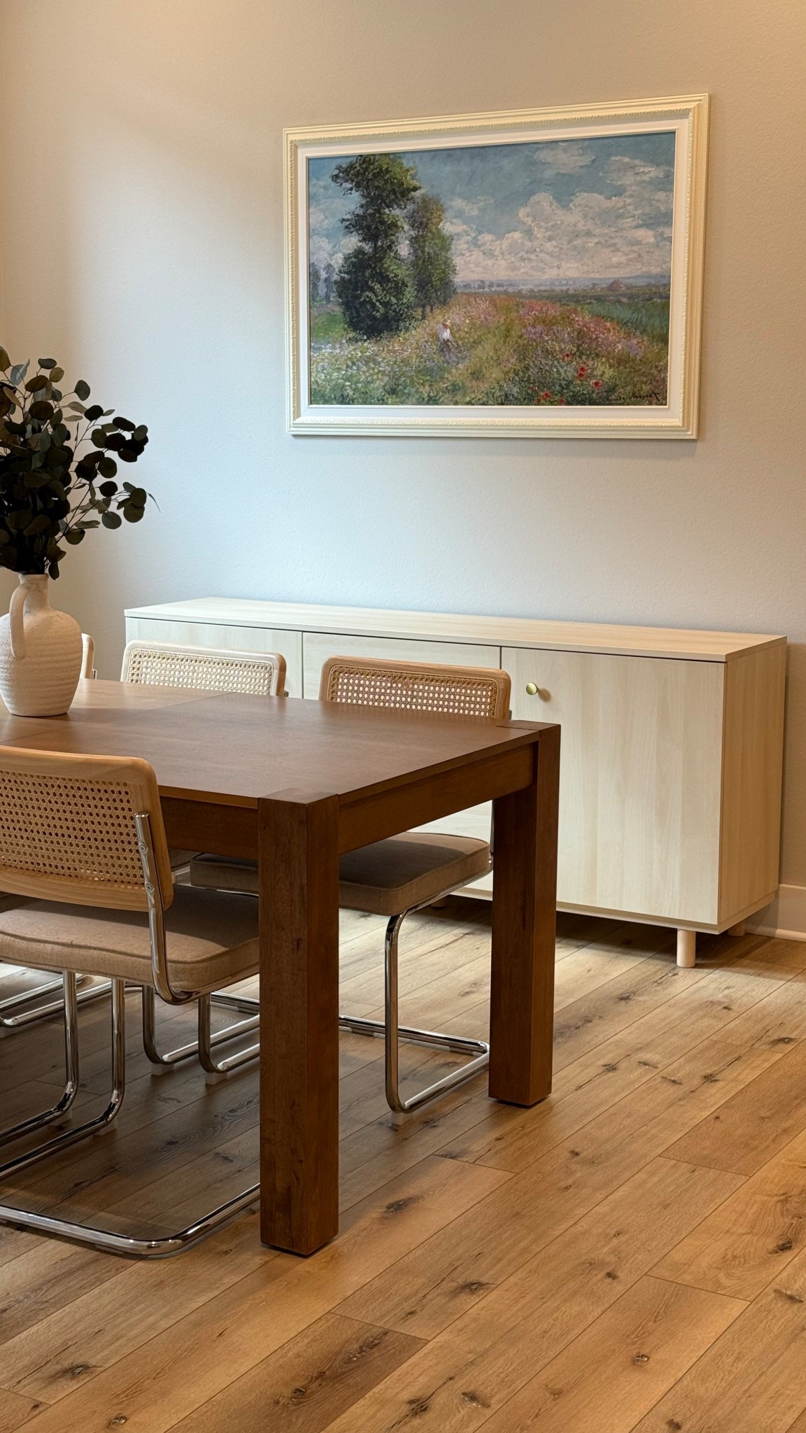 Finally finish my dining room! 
The buffet cabinet is from Ikea, and the wall art is a Monet inspired that I found at HomeGoods 🤩