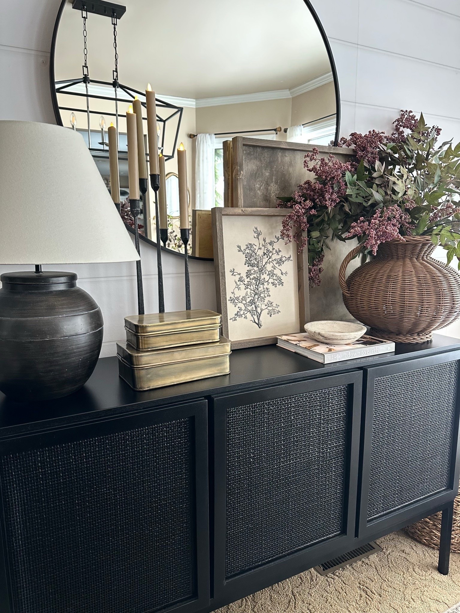 Neutral Dining Room Sideboard Styling Ideas

Follow @farmtotablecreations on Instagram for more neutral home styling ideas.

A look at how I styled this dining room sideboard with layered neutral artwork, taper candles, brass storage boxes, and a woven vase filled with faux stems. Mixing warm wood tones, brass accents, and natural textures helps create a cozy, collected look while the large round mirror reflects light and makes the space feel even more open.

#sideboard #diningroomdecor #diningroomsideboard #consoletablestyling #neutraldecor #tapercandles #wovenbasket #diningroomfurniture #homedecor #wallmirror #homeaccents



#LTKSaleAlert #LTKHome