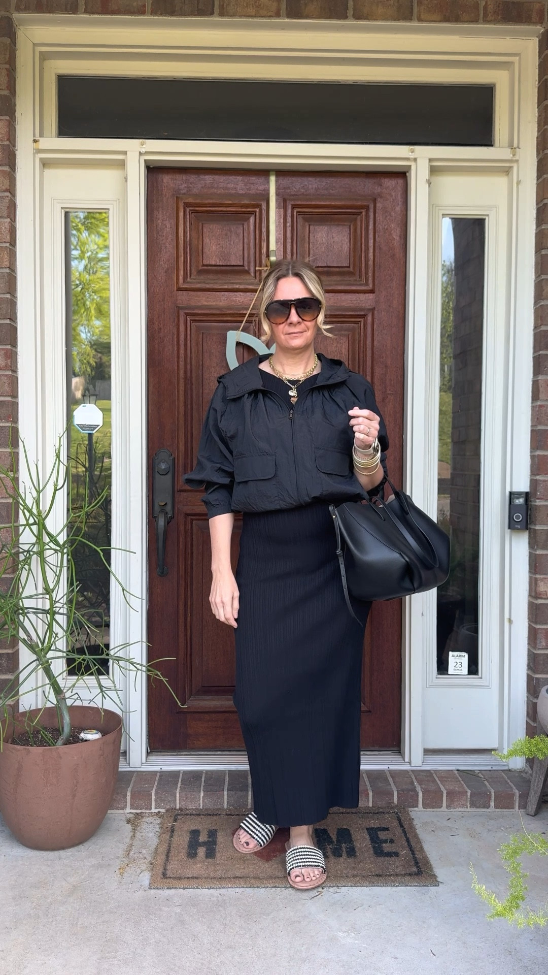 OOTD for a day of errands and client shopping ✨ Black ribbed midi dress + black windbreaker + Jack Rogers black and ivory beaded slide + bracelet stack + necklace stack + black tote. Most of these pieces are still shoppable — linked everything below! 👇

#LTKootd #LTKdayinmylife #LTKOver40