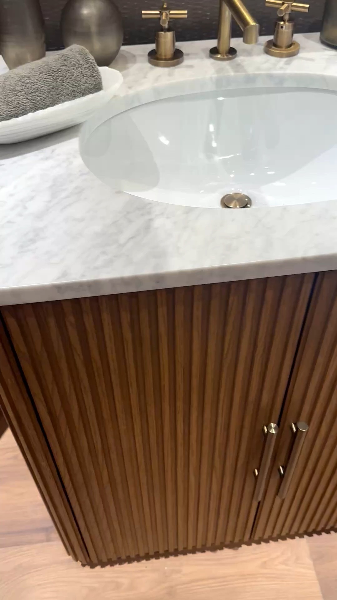 A well-designed vanity can completely elevate the feel of a bathroom. This double sink vanity pairs a beautifully reeded facade with a marble top for that modern chic look I always love — elegant, tailored, and functional at the same time. The center drawers add the perfect amount of hidden storage while still keeping the space feeling refined and elevated.

Memorial Day Sale — up to 50% off now.

#bathroom #bathroomdesign #doublevanity #vanity #bathroomvanity #marbletop #reededwood #modernbathroom #modernchic #luxurybathroom #storageideas #bathroomstorage #interiordesign #homedecor #bathroominspo #marble #sink #doublesink #ltkhome #memorialdaysale

#LTKdayinmylife #LTKHome #LTKSaleAlert