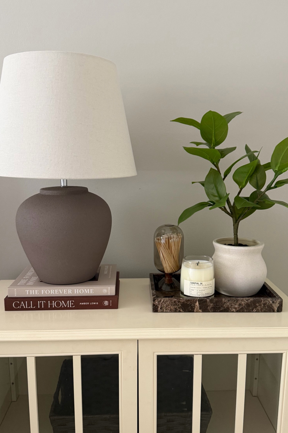 Guest bedroom nightstand decor! Wanted it to feel extra cozy for our guests ☺️

Home decor, neutral decor, bedroom decor, nightstand decor, marble tray, faux plant, candle, lamp, coffee table book 

#LTKHome