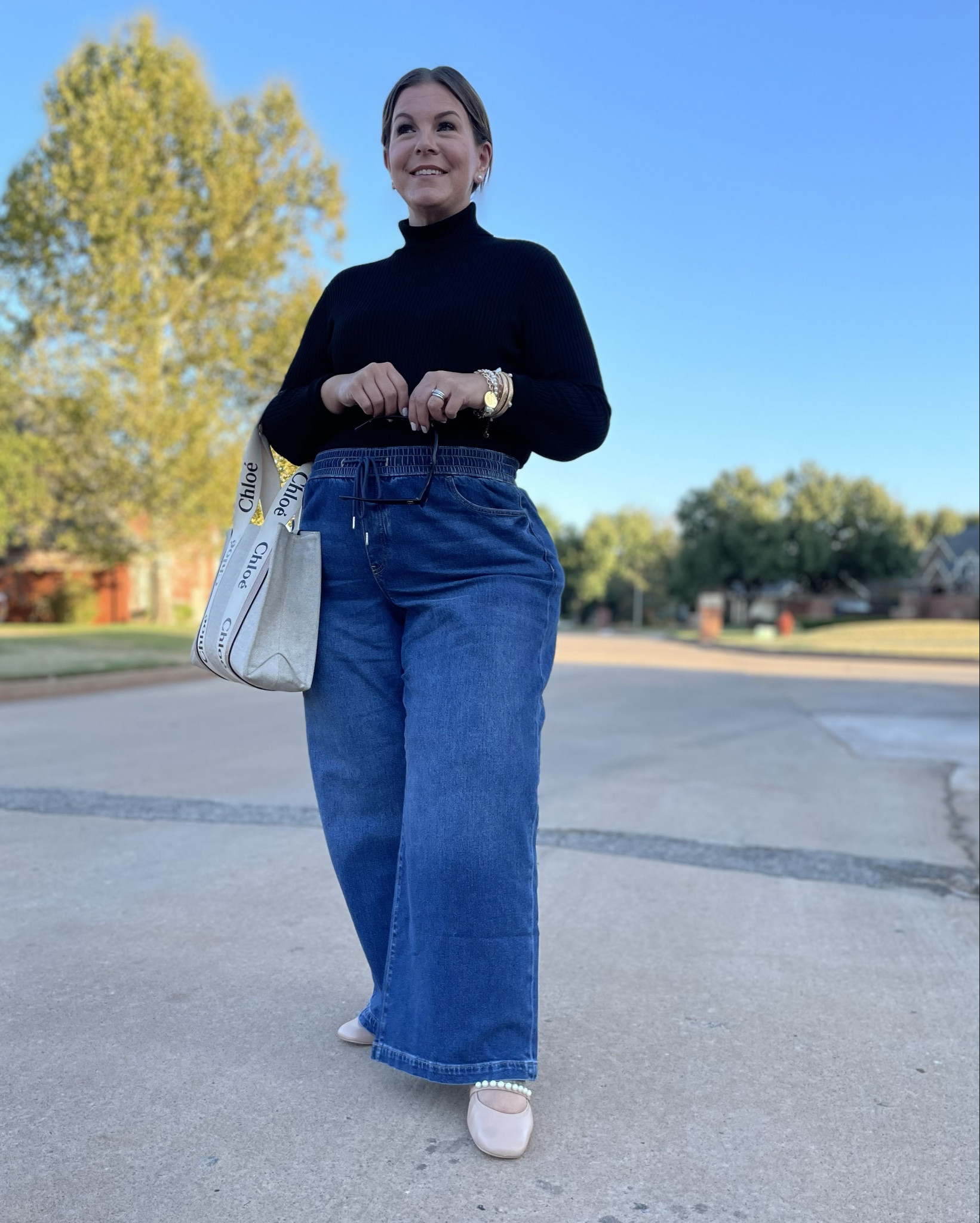 Fall outfit idea 🍂 Curvy + pear shaped edition! This black turtleneck is a classic piece that never goes out of style and it’s under $20, wearing XL. These plus size wide leg jeans are so comfy and fun to wear, I’m in my true size 18. 

#LTKPlusSize #LTKOver40 #LTKMidsize