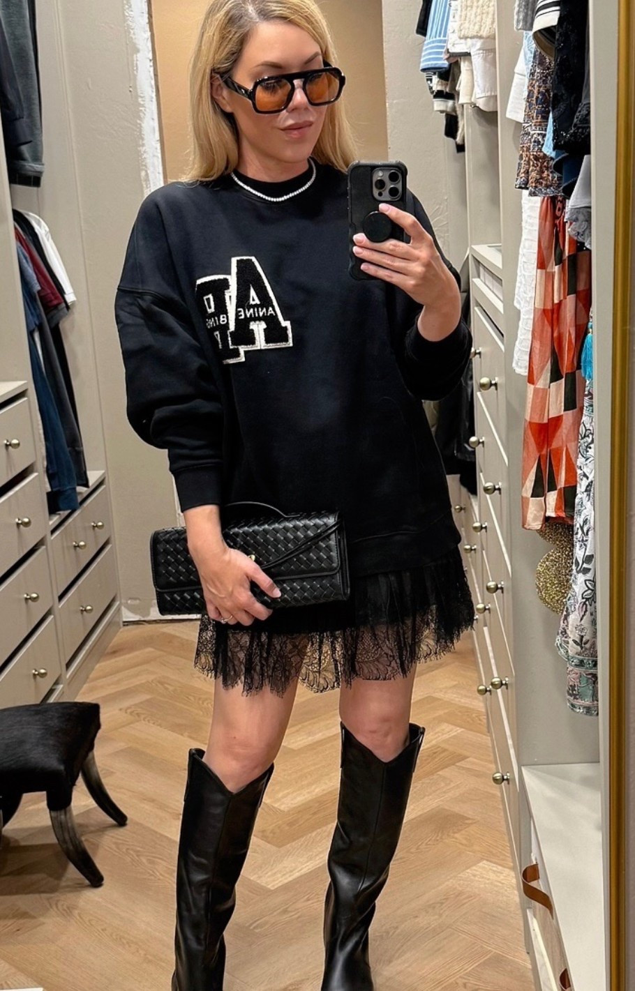 Anine Bing sweatshirt 
Lace skirt
Western boots 

#LTKSeasonal #LTKFindsUnder50