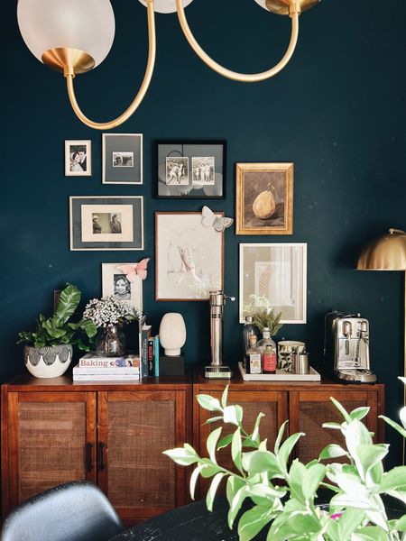 Golden hour in the dining room.
#smalldingroom - dining room decor - affordable home decor - gallery wall frames - Benjamin Moore Gentleman’s Gray paint color - blue wall color - gold floor lamp - affordable lighting - wood and cane cabinets - Aarke water carbonizer - nespresso  machine - gold and glass globe chandelier - West Elm - Target - Studio McGee - affordable side board buffet  

#LTKunder100 #LTKhome