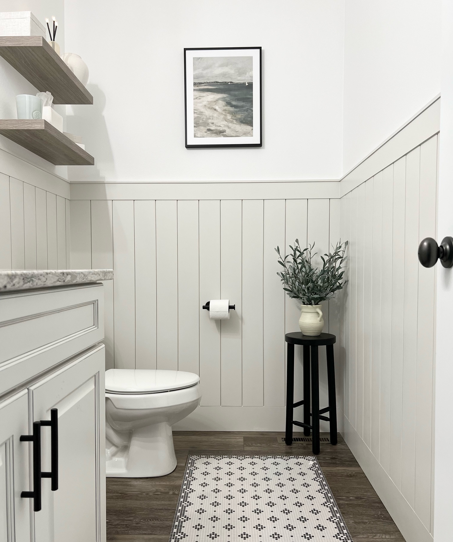 Half bath / digital artwork / digital prints / bathroom decor / olive plant / floating shelves / etsy finds / black cabinet hardware / cabinet pulls / tissue box cover / everlasting candle / candles / plant stand / side table / black frames 

#LTKunder50 #LTKstyletip #LTKhome