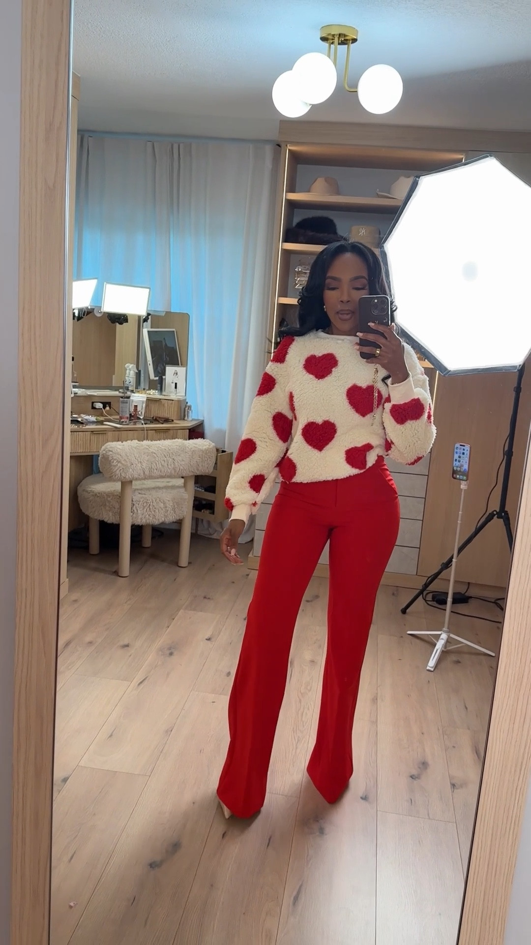 Heart Eyes for Valentine’s ❤️ — A cozy-meets-flirty look that’s perfect for the season. This fuzzy heart sweater paired with bold red trousers is playful, polished, and so easy to style again beyond Valentine’s Day. Wear together for a statement look or mix each piece with your everyday staples to maximize cost per wear.

Perfect for date night, Galentine’s plans, or a fun dinner out.

📏 Sizing:
@Express heart sweater — Size Small  
@Express red trousers — Size Small  

📐 Measurements:
Height: 5'4"  
Weight: 138 lbs  
Bust: 34D  
Waist: 27"  
Hips: 40"

This is one of those outfits where the cost per wear drops fast — the sweater works with jeans, skirts, or trousers, and the red pants instantly elevate neutrals all year long. Save this post to revisit later.

Follow me on Instagram and YouTube @kirasfashionfinds