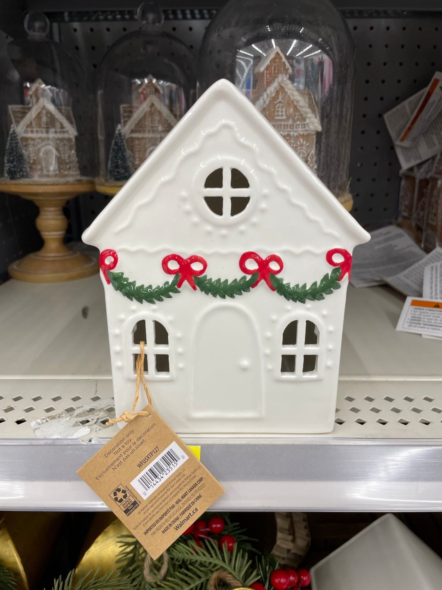 How adorable is this ceramic holiday house from Walmart?! Love the garland with red bows. Lights up too! (Large size is currently on sale online.)

#LTKHome #LTKHoliday #LTKSeasonal