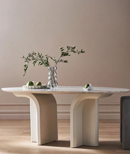 New dining table from Anthropologie. Love the chic oval marble top and tropical wood base. It will elevate any dining space with timeless charm. #diningroom

#LTKhome #LTKSpringSale #LTKfamily