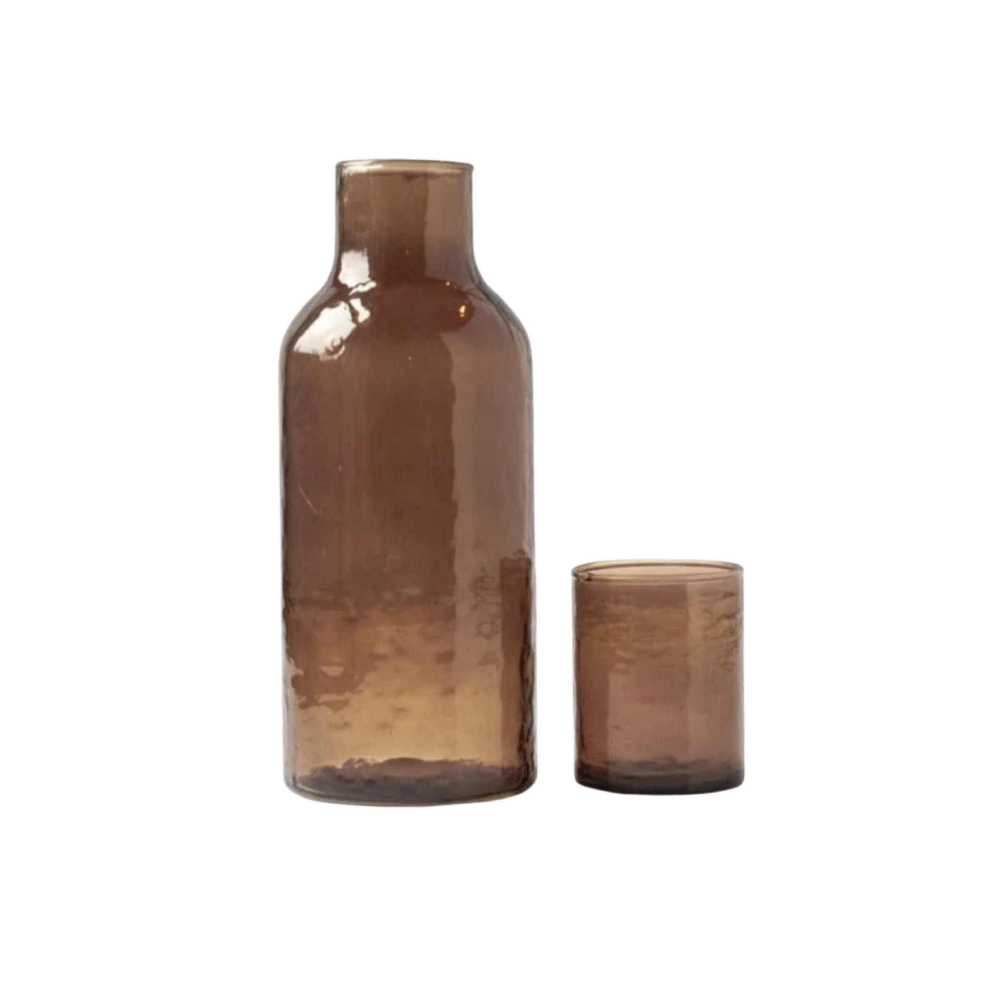 This smoky brown glass carafe and matching cup set is the perfect nightstand or guest room essential. Its warm, modern aesthetic fits beautifully into neutral homes and minimalist spaces. A functional yet elevated home find that instantly adds a designer feel to your bedside, bathroom, or kitchen styling. Perfect for gifting or upgrading your own home.

#LTKFindsUnder50 #LTKHome #LTKSaleAlert