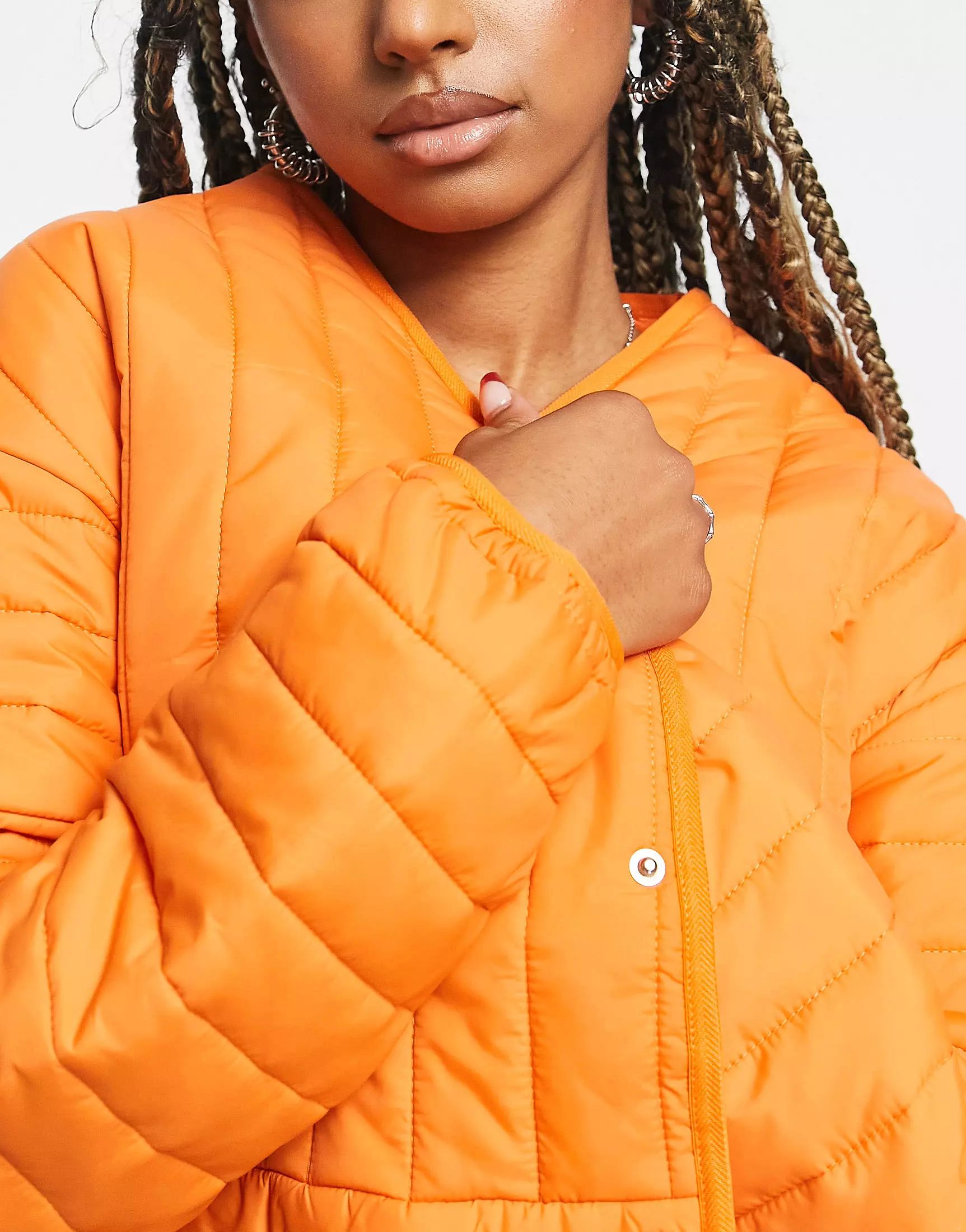 › Reclaimed Vintage unisex quilted liner jacket in orange color | ASOS (Global)