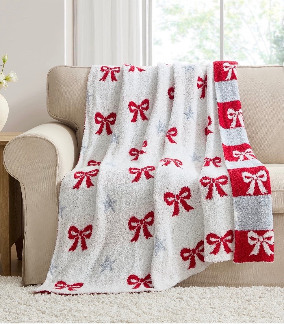 With its mix of cozy texture and bold red, white, and blue details, the My Texas House Bows and Stars Throw brings a cheerful accent to your home. This 50-inch by 60-inch throw features rows of bright bows and soft star motifs that add color and charm to sofas, chairs, and bedrooms. The plush material makes it great for relaxing on cooler evenings, and the reversible design gives you two looks to enjoy. Its bold pattern pairs well with coordinating summer pieces and helps create a welcoming atmosphere wherever you place it. You can drape it over furniture or fold it at the end of a bed to refresh your space with ease. The My Texas House Bows and Stars Throw is a wonderful way to add warmth and style to your home.

#LTKMothersDay #LTKSeasonal #LTKHome